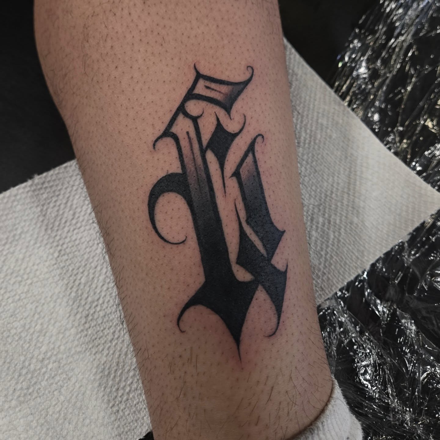 Letter 'M' black and grey tattoo on the forearm by DiazTattoos, Denver, Colorado