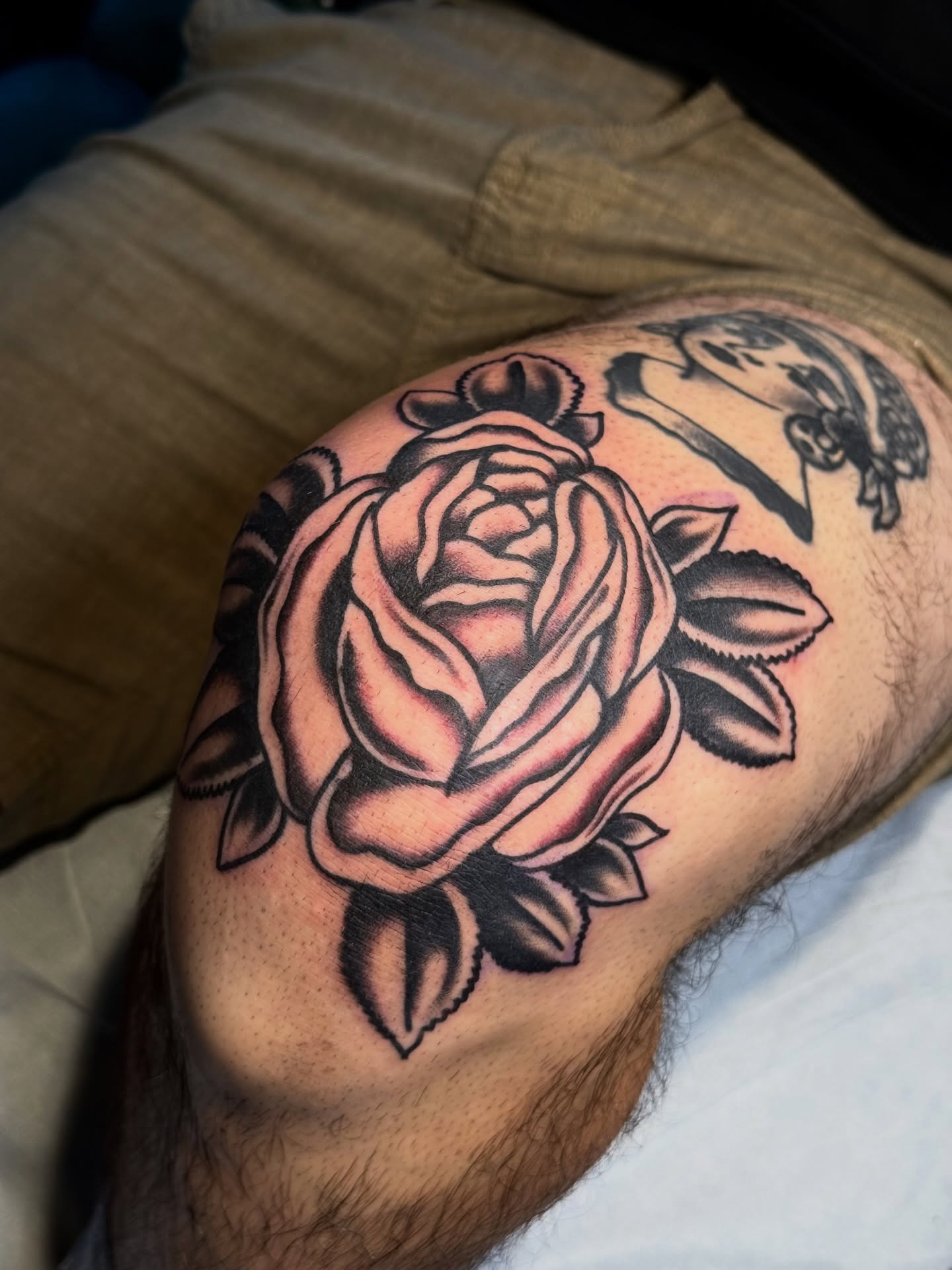 Rose American traditional tattoo on the thigh by Clayton - TRADITIONAL TATTOOS