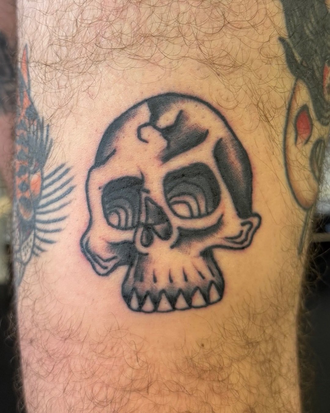 Skull black and grey tattoo on the forearm by Nick Tumminello