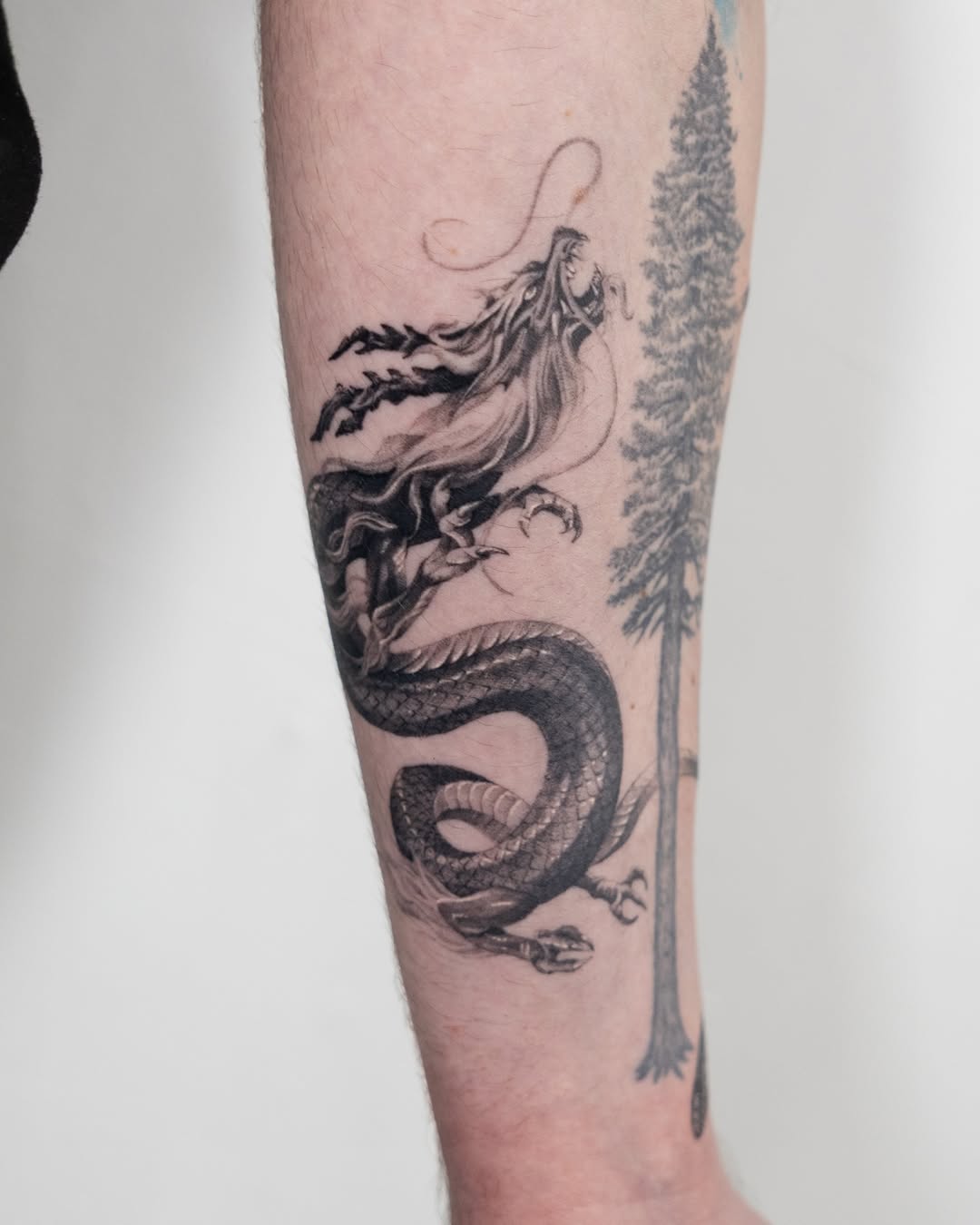 Tattoo by @turner_tattoos — realism, black_and_grey