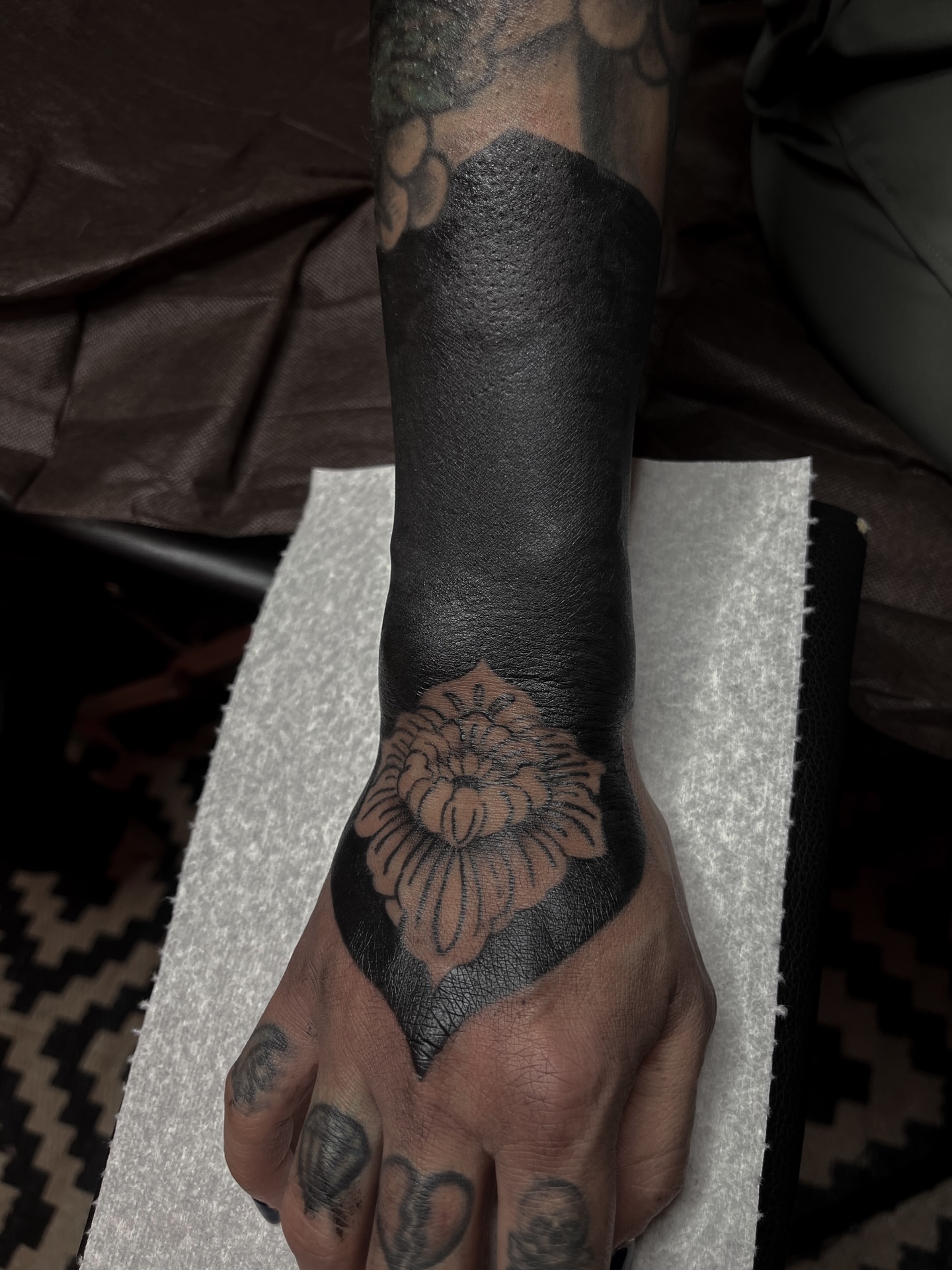 Flower black and grey tattoo on the hand by ⚜️Embodied Tattoo⚜️, Columbus, Ohio