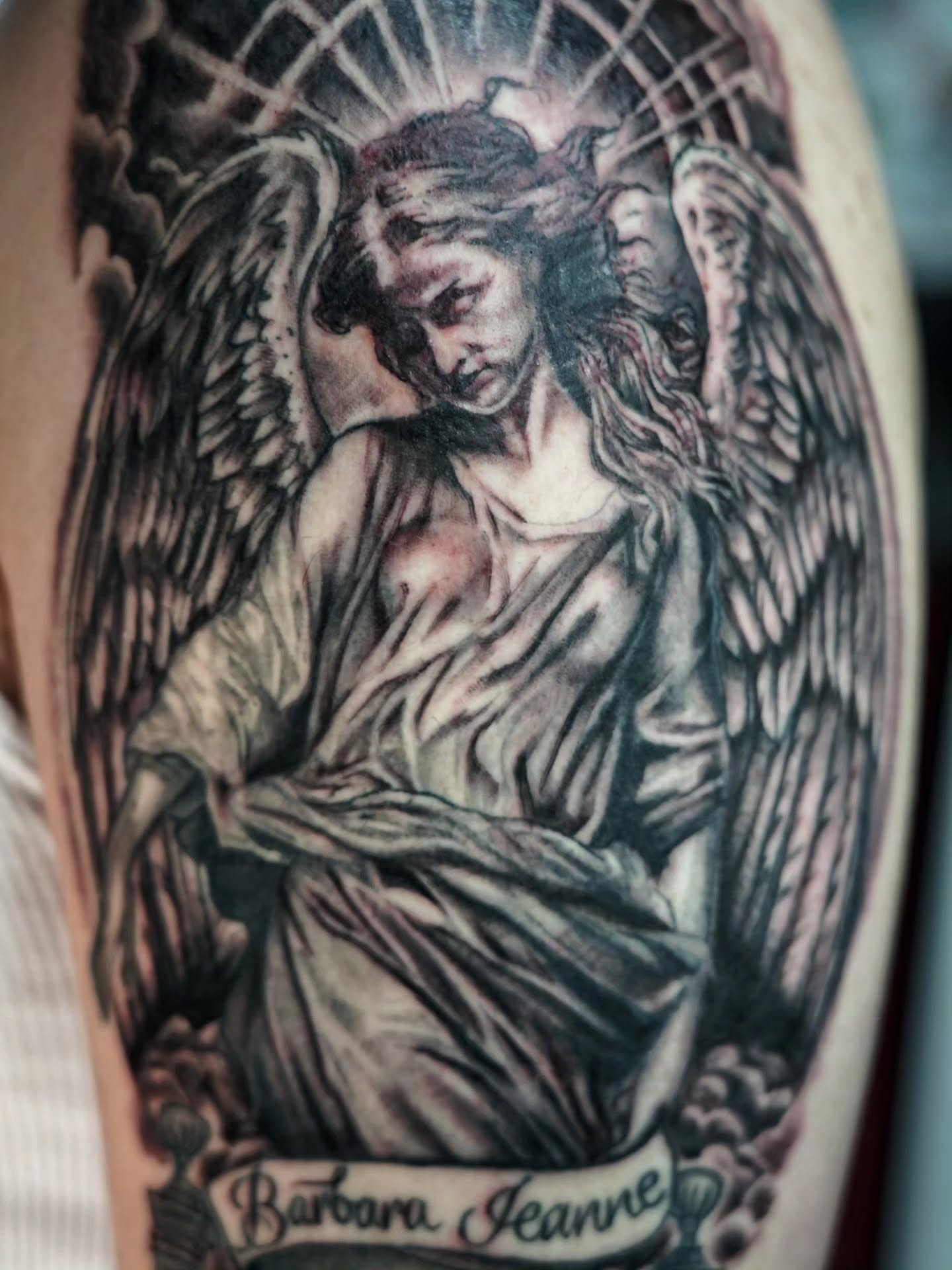 Angel realism tattoo on the forearm by Spicoli