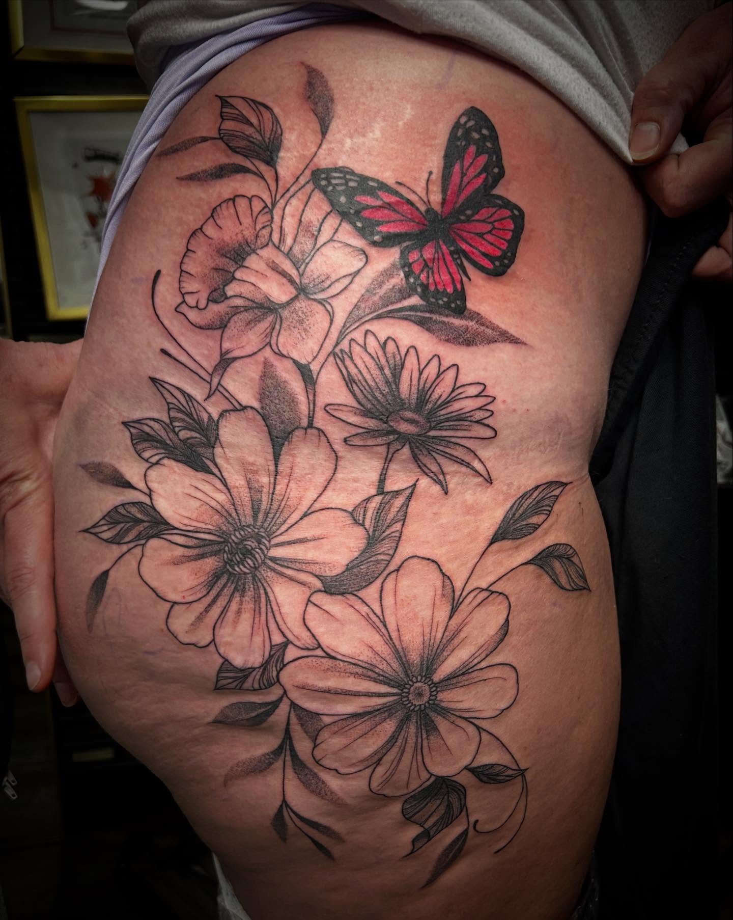Flowers and butterfly black and grey tattoo on the thigh by ✶ 𝓑𝓲𝓽𝓮𝓼𝓲𝔃𝓮𝓭 𝓘𝓷𝓴 ✶, Buford, Georgia