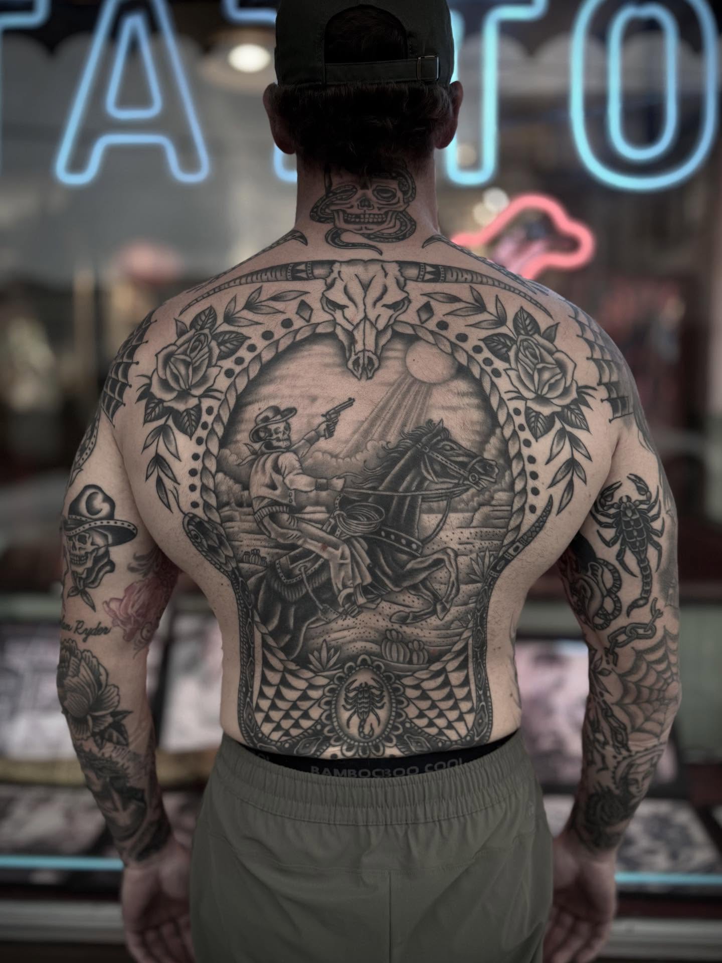 Cowboy and horse American traditional tattoo on the back by Micah Norman, San Francisco, California