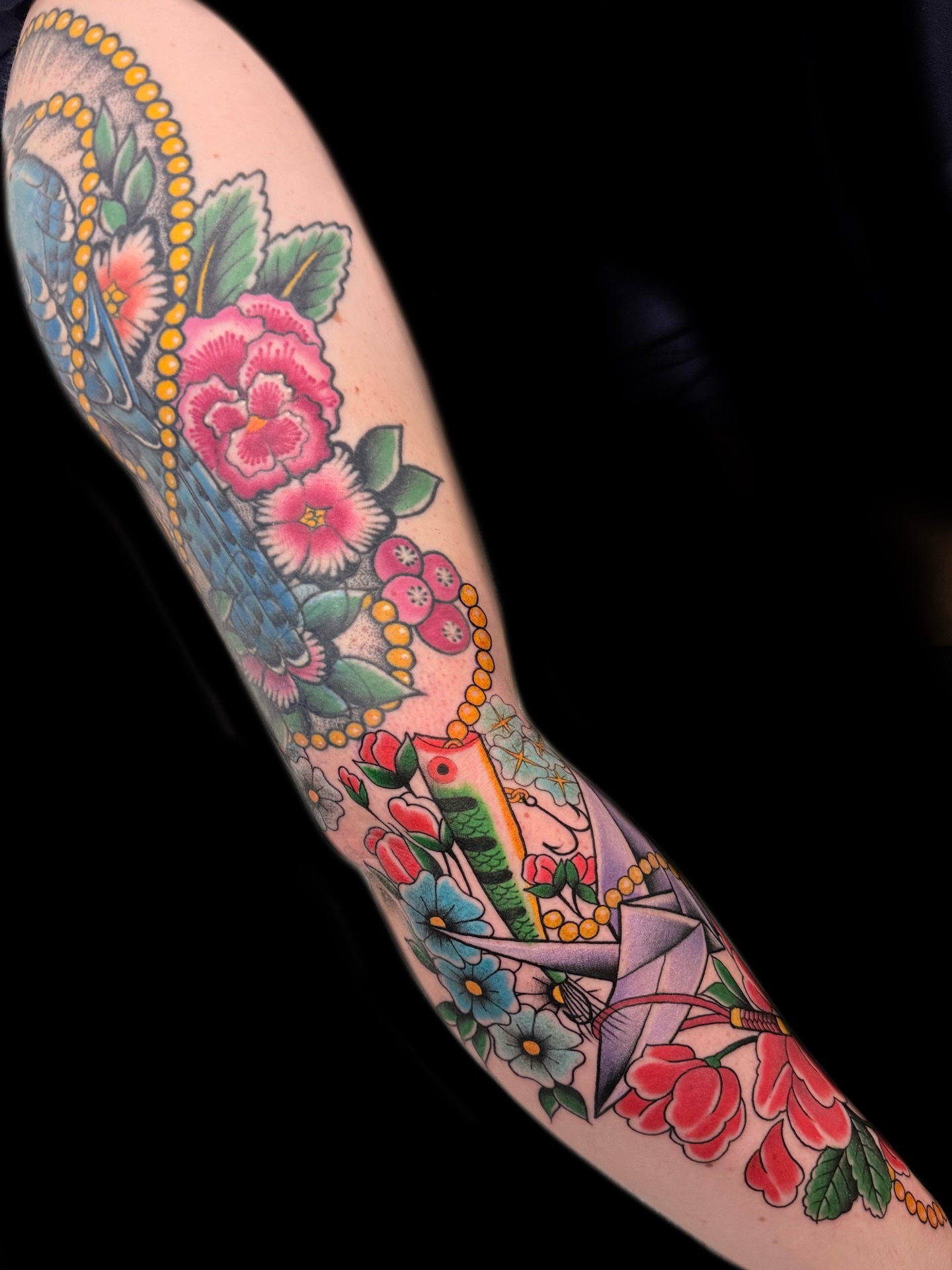 Floral arrangement American traditional tattoo on the forearm by Jhon