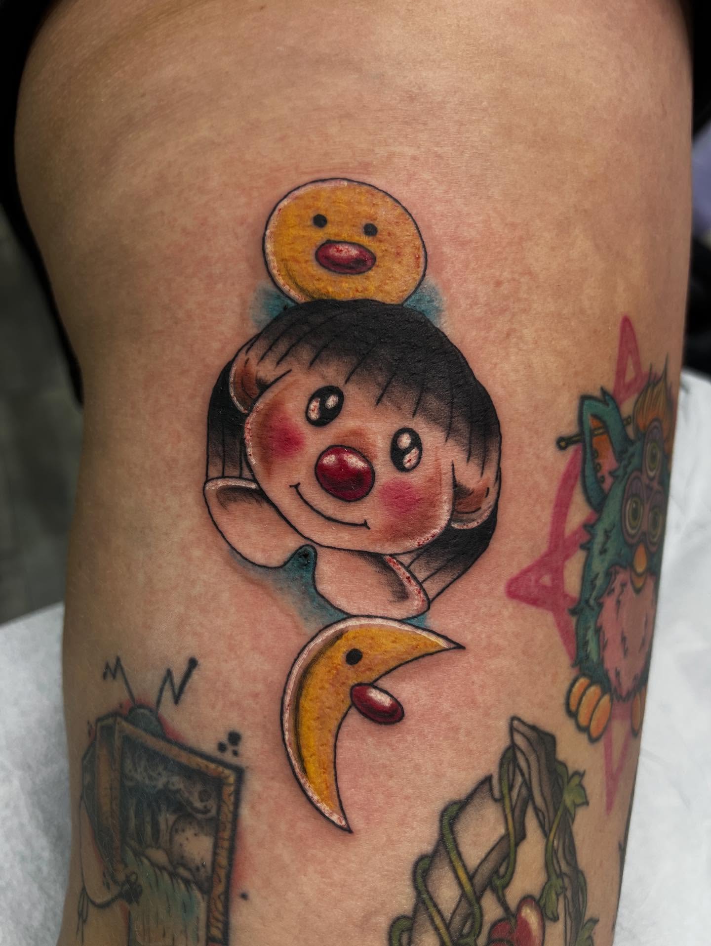 Clown American traditional tattoo on the thigh by Monii Arreola