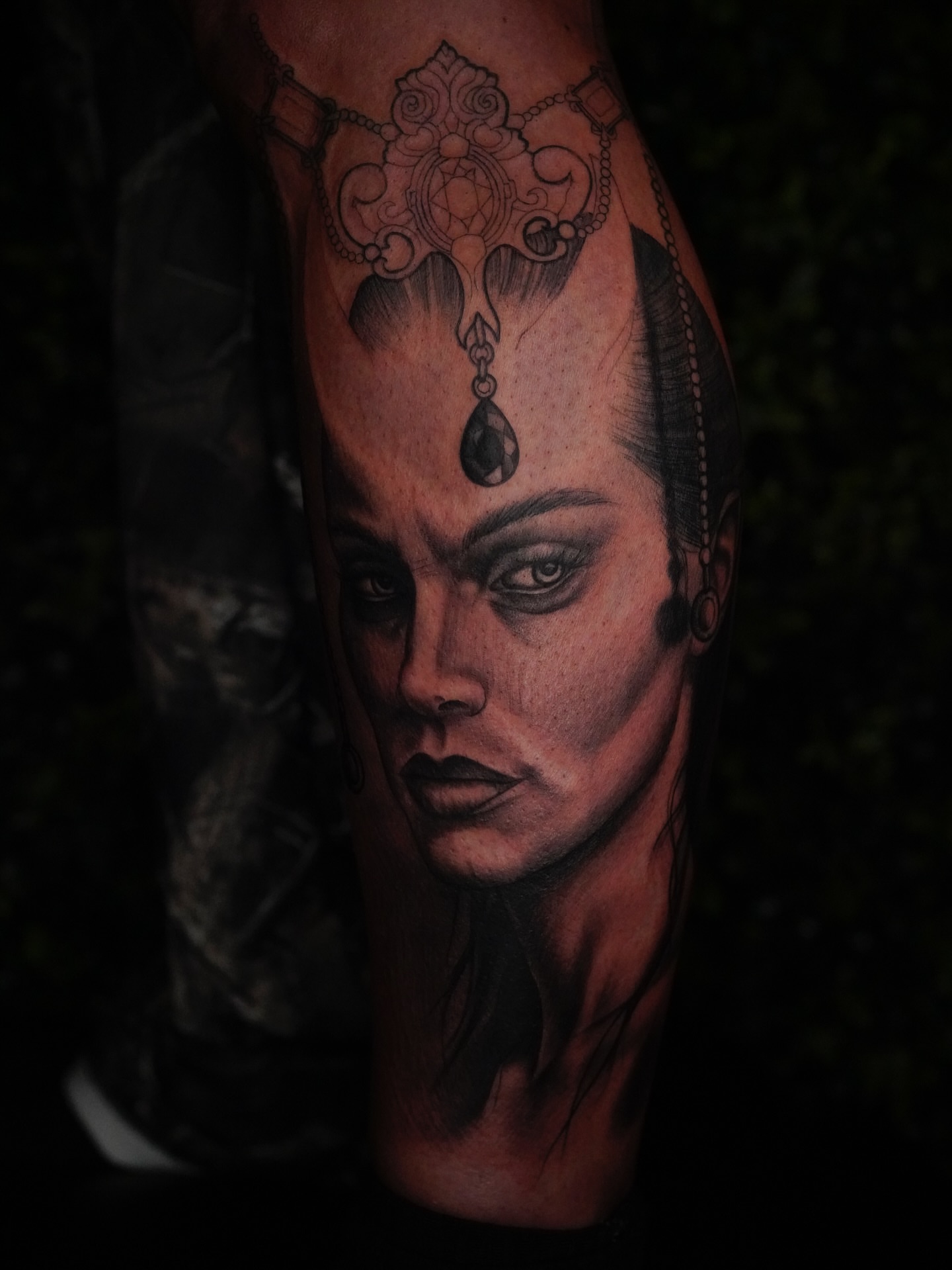 Woman's face realism tattoo on the forearm by Jaiden Ducoff