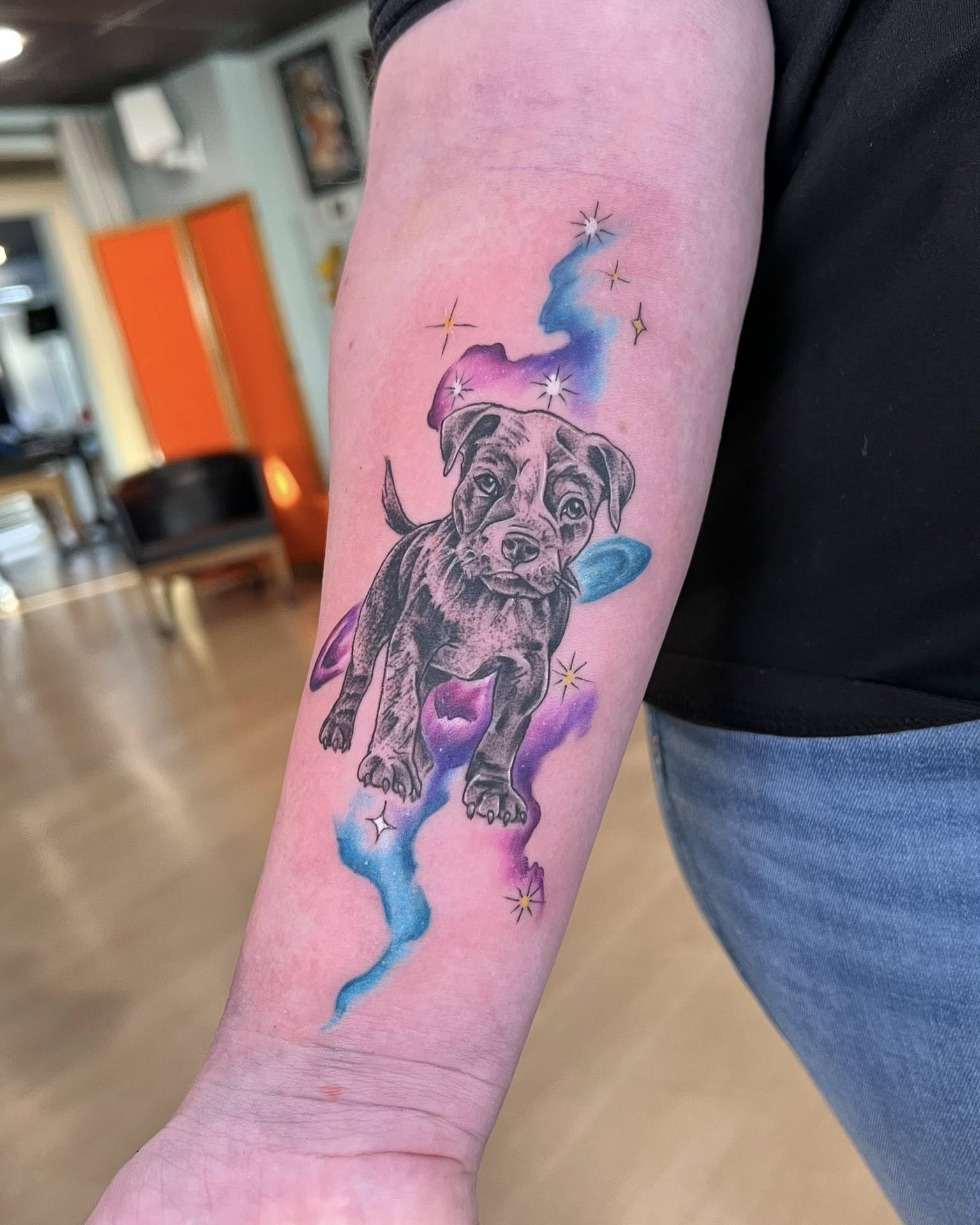 Dog with frisbee new school tattoo on the forearm by Jessica Kloos