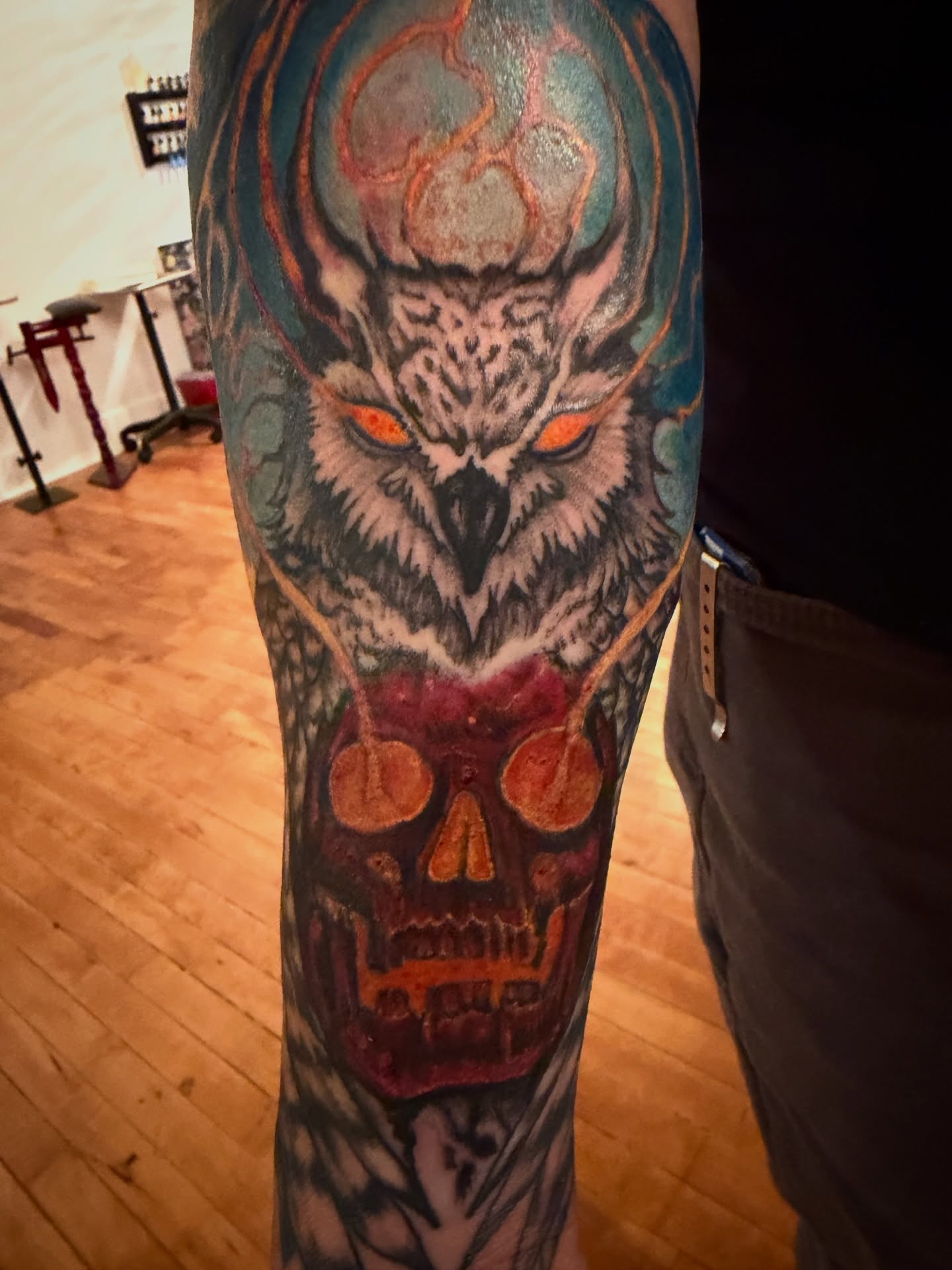 Owl and skull realism tattoo on the forearm by steven