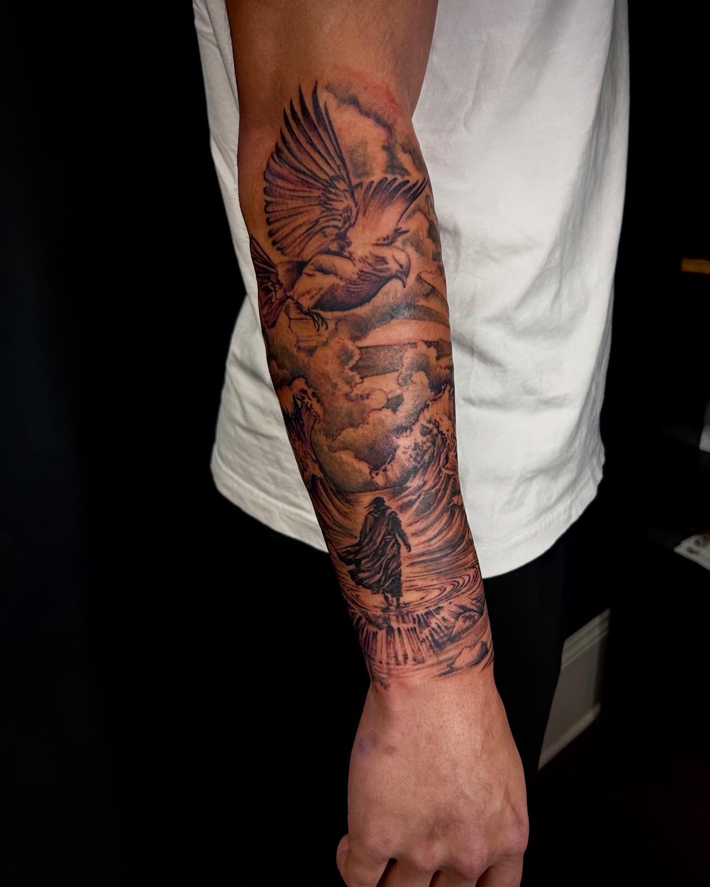 Angelic figure realism tattoo on the forearm by Jon Byrd