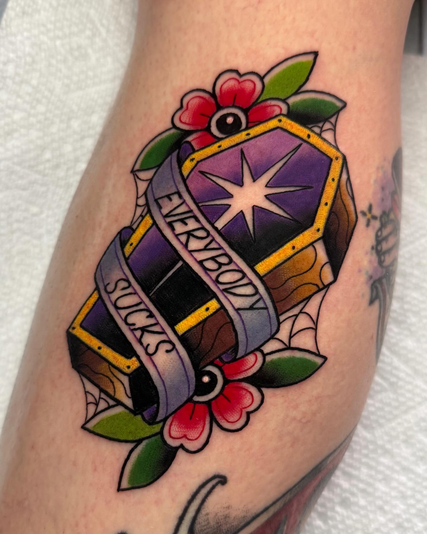 Coffin with ribbon American traditional tattoo on the forearm by 𝔎𝔦𝔯𝔞 𝔅𝔦𝔰𝔥𝔬𝔭