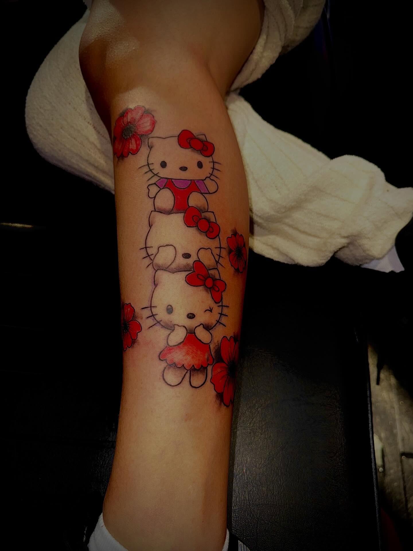 Hello Kitty dotwork tattoo on the forearm by Clifford Jordan