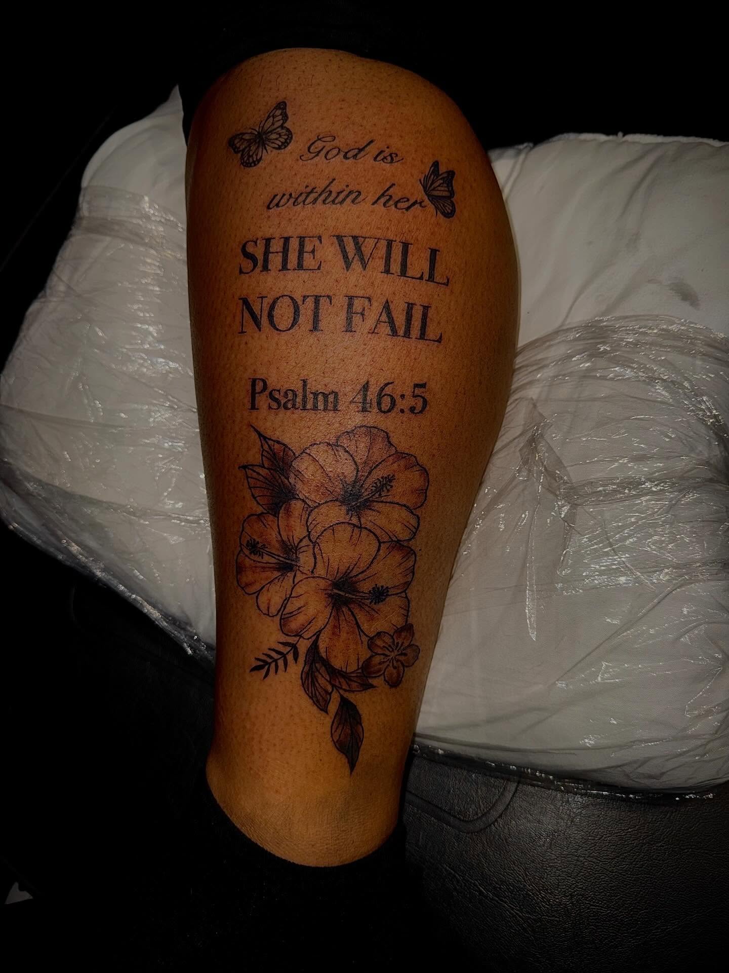 Religious quote black and grey tattoo on the forearm by Clifford Jordan