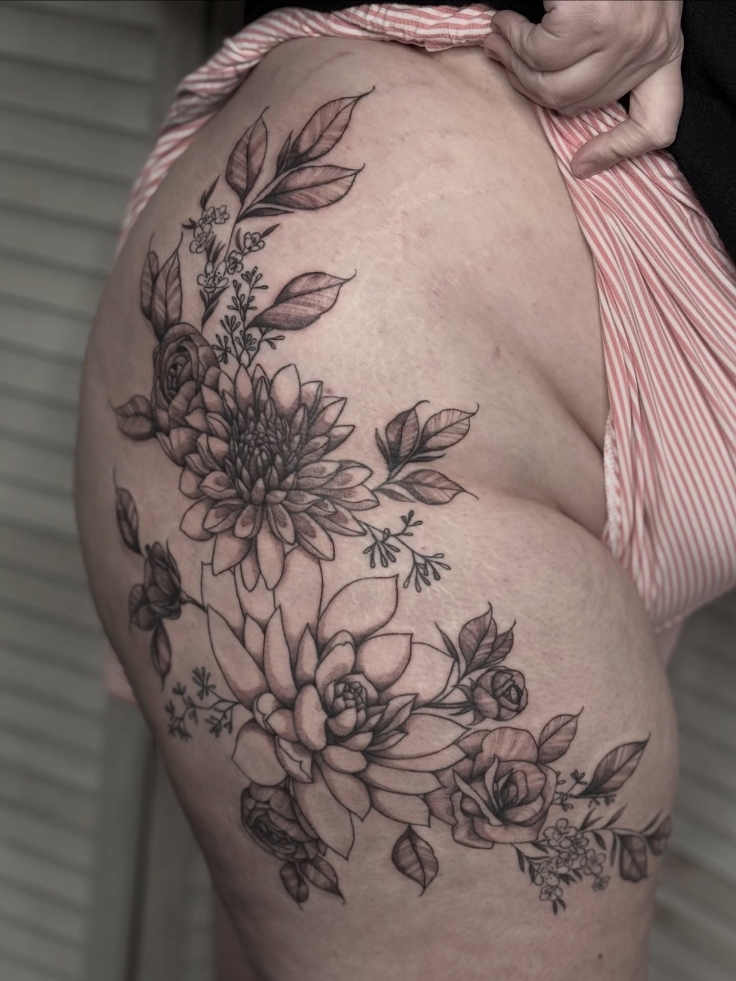 Floral arrangement black and grey tattoo on the shoulder by Emersyn DeLuna