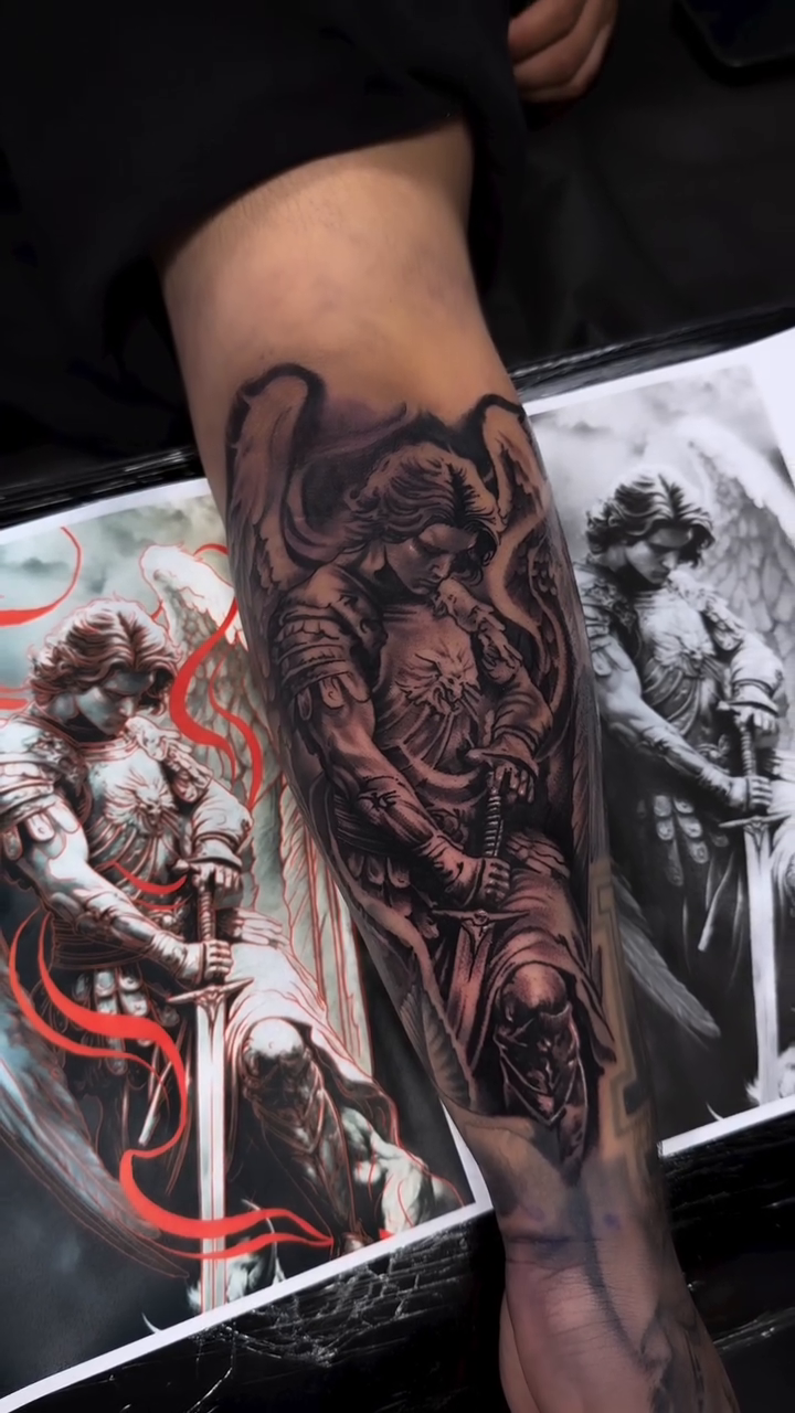 Angel with sword dark realism tattoo by Oscar Baiza