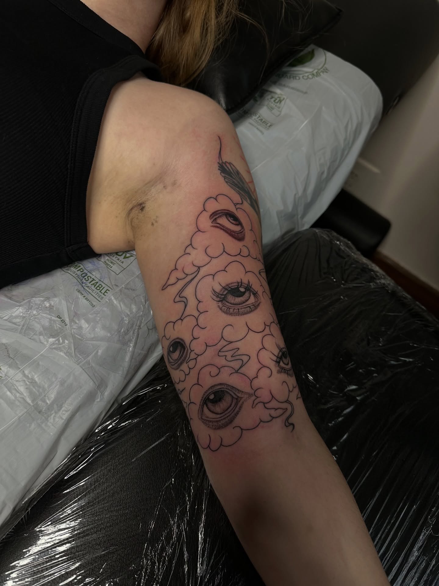 Eyes in clouds black and grey tattoo on the forearm by แดแด ๐ฎ๐ท ๐ฆ๐ซ