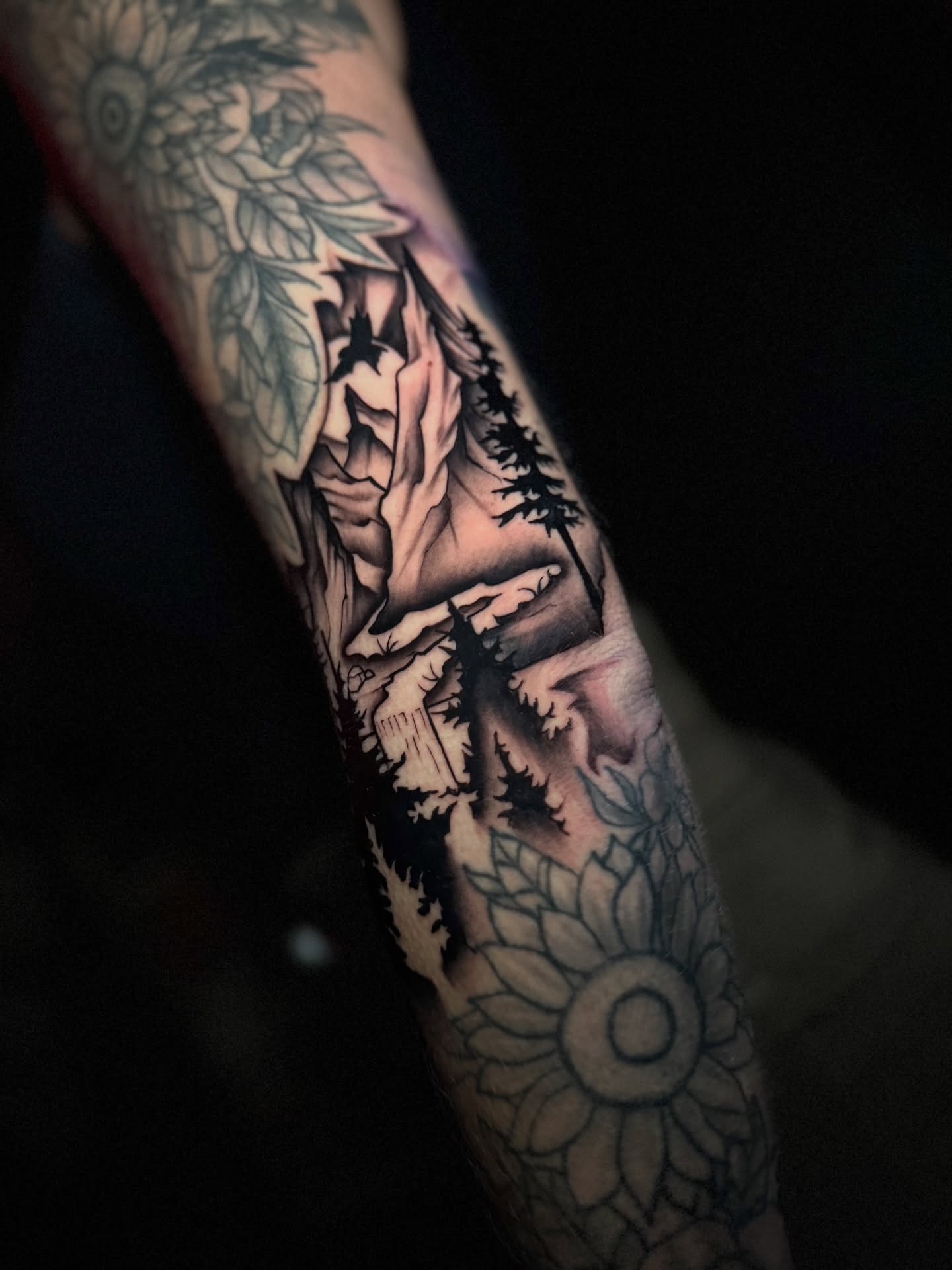 Mountain landscape American traditional tattoo on the forearm by Ryland - Tattoo Artist