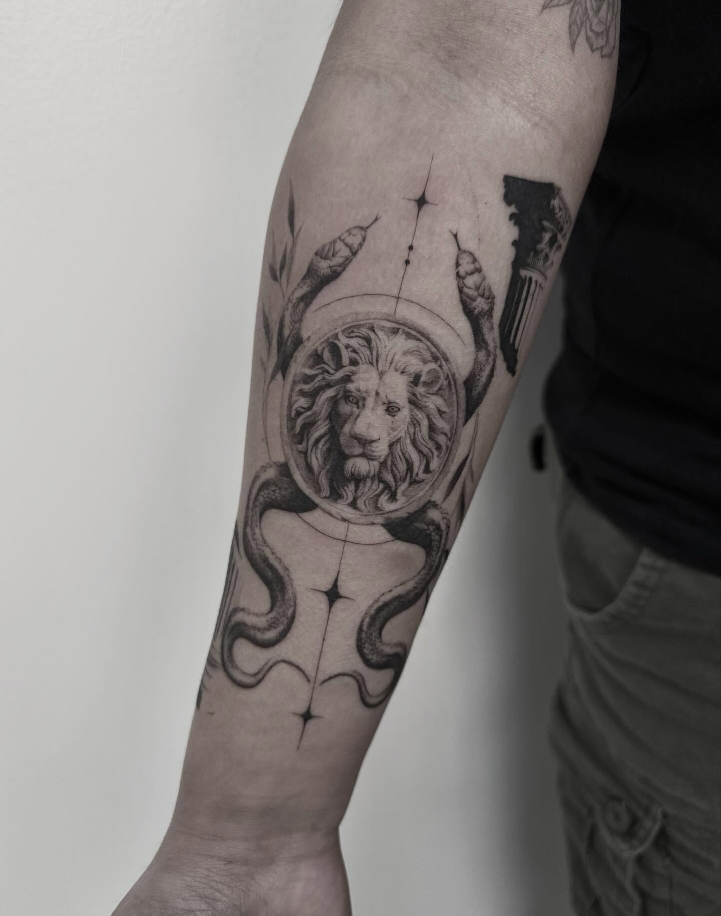 Lion and snakes realism tattoo on the forearm by ππππππ