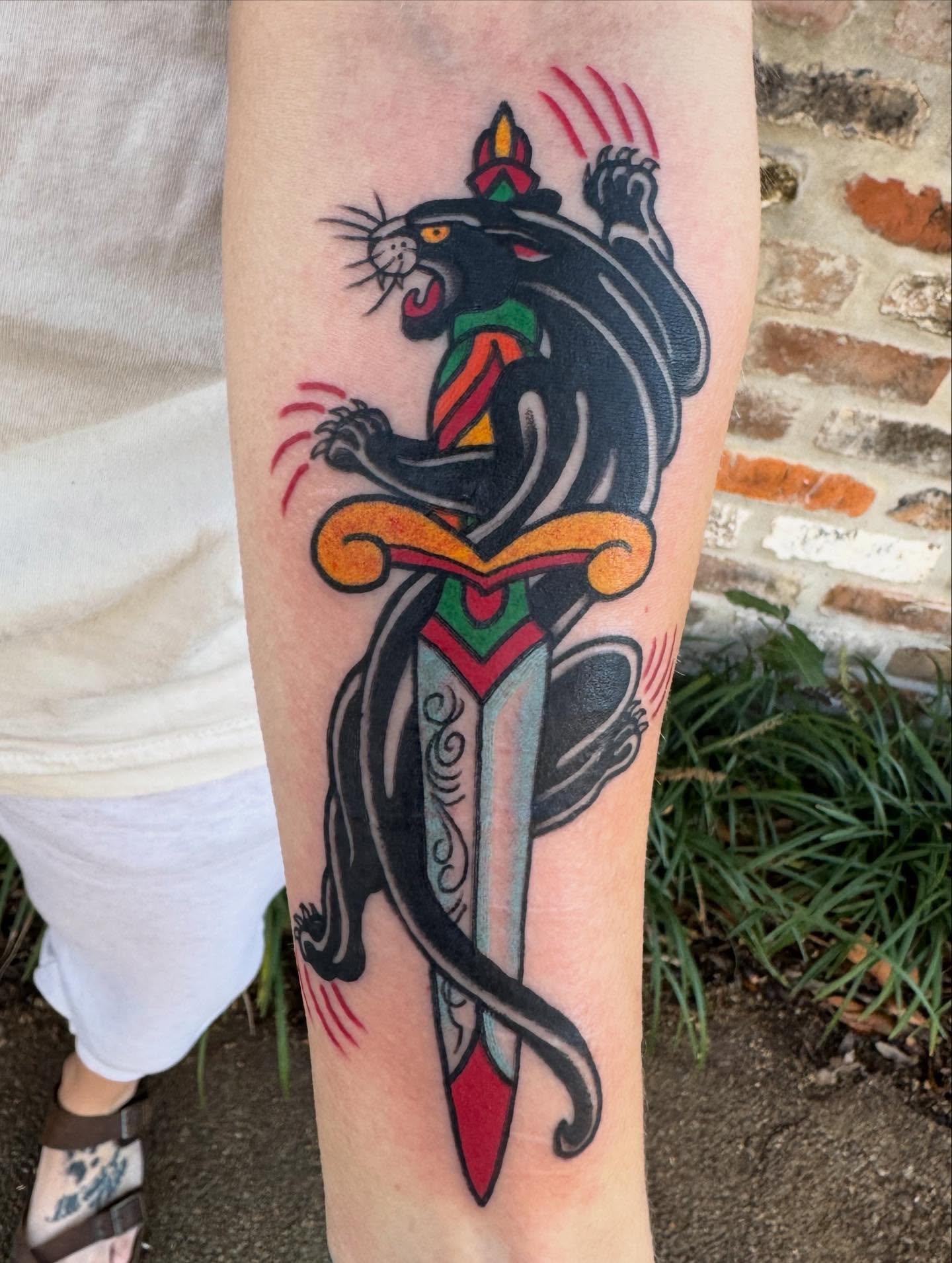 Panther and dagger American traditional tattoo on the forearm by Jeremy Justice, New Orleans, Louisiana