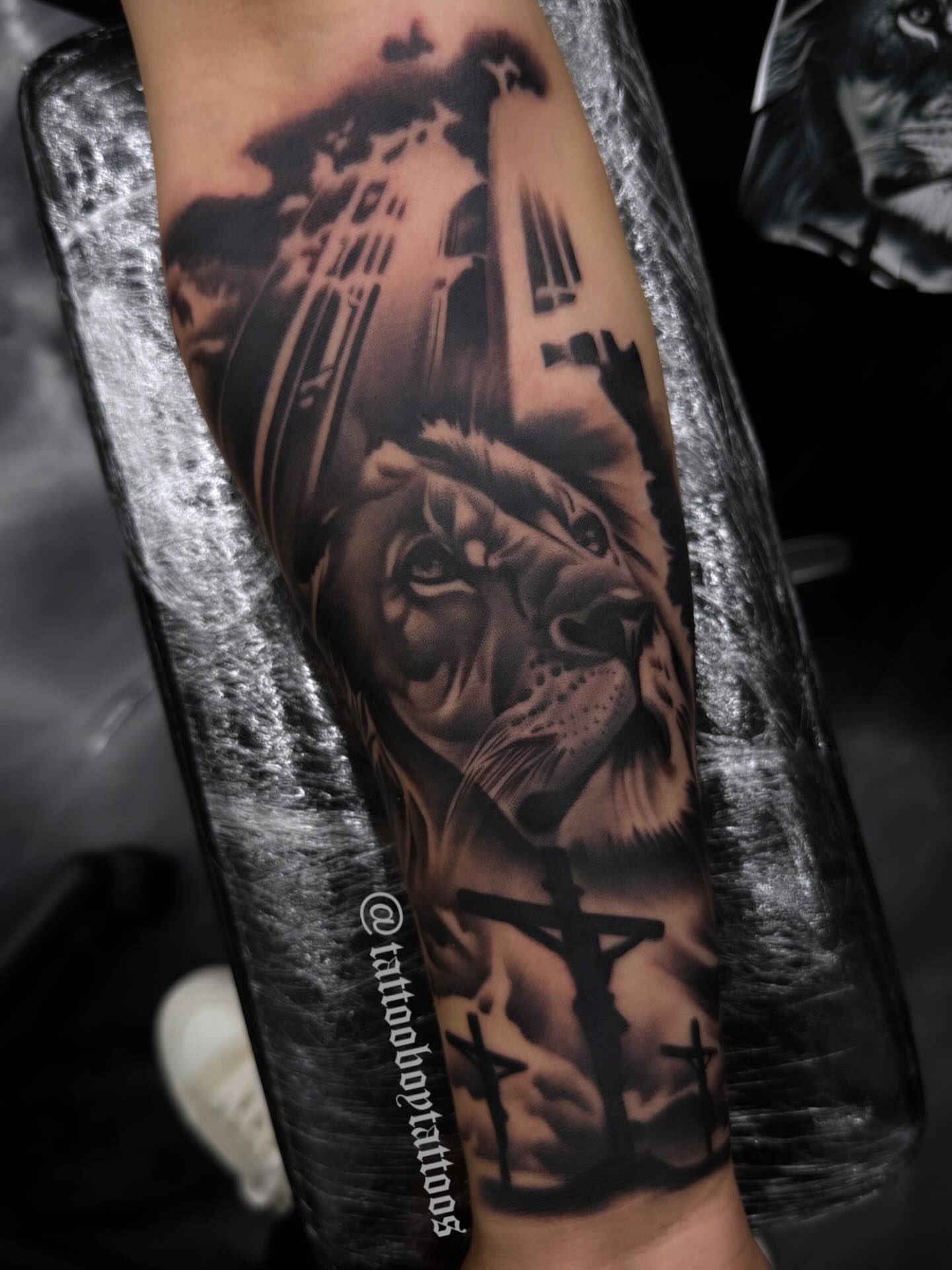 Lion realism tattoo on the forearm by TattooBoyTattoos