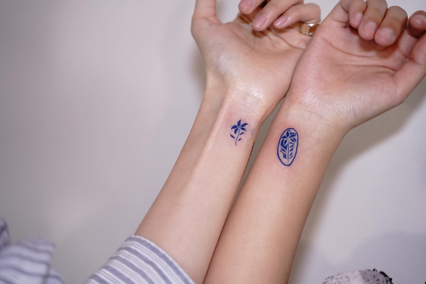 Floral geometric tattoo on the forearm by Tomato