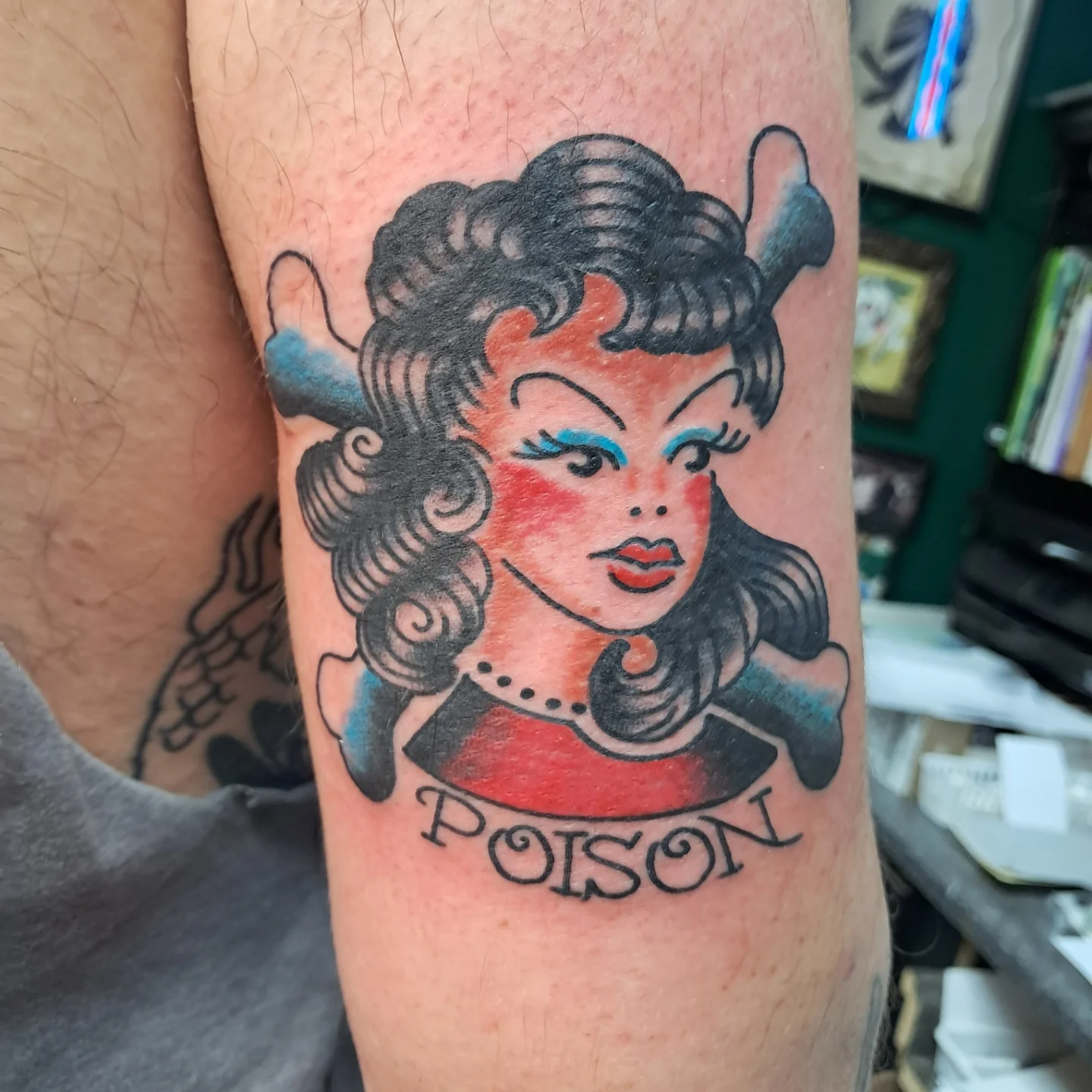 Woman with devil horns American traditional tattoo on the forearm by Reb Fularz