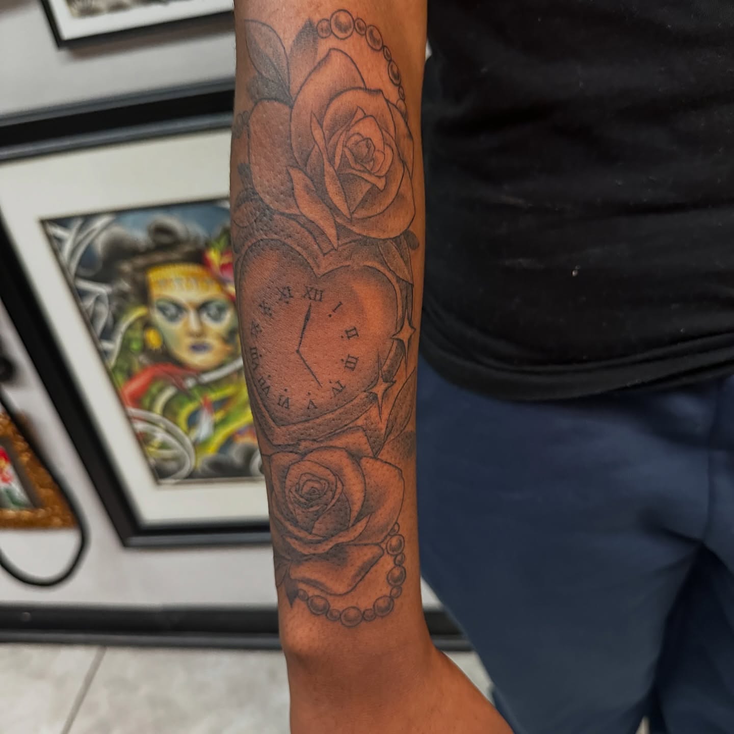 Roses and clock black and grey tattoo on the forearm by Mia Layne 🤎