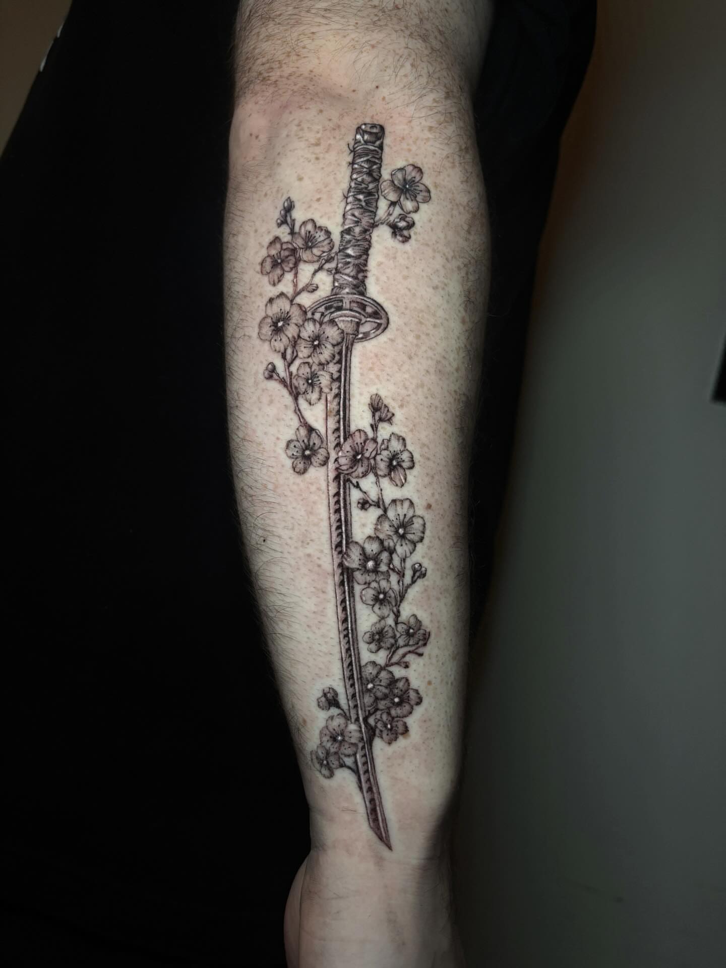 Cherry blossoms and sword black and grey tattoo on the forearm by l i z ✶