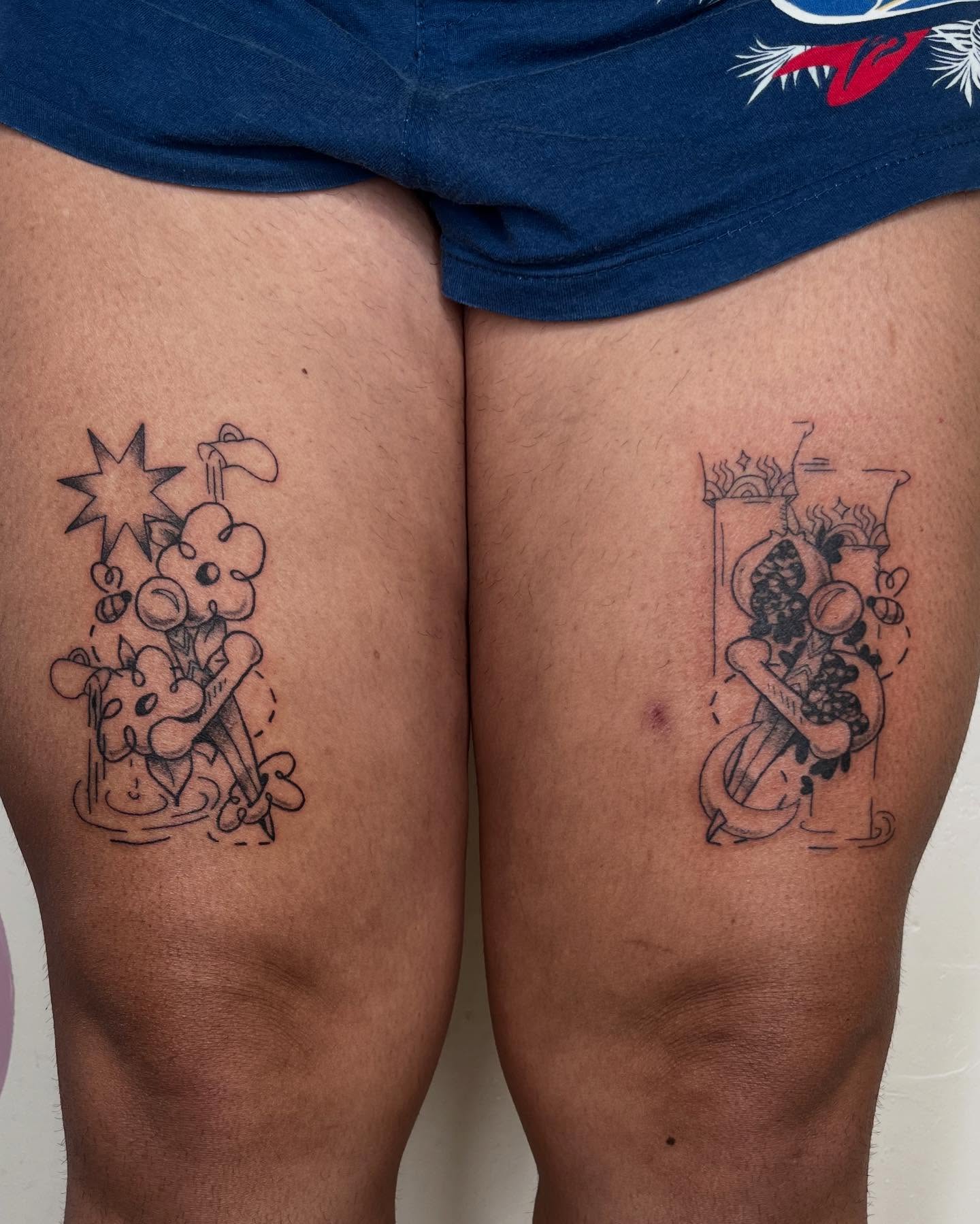 Cartoon character black and grey tattoo on the thigh by luce elias :