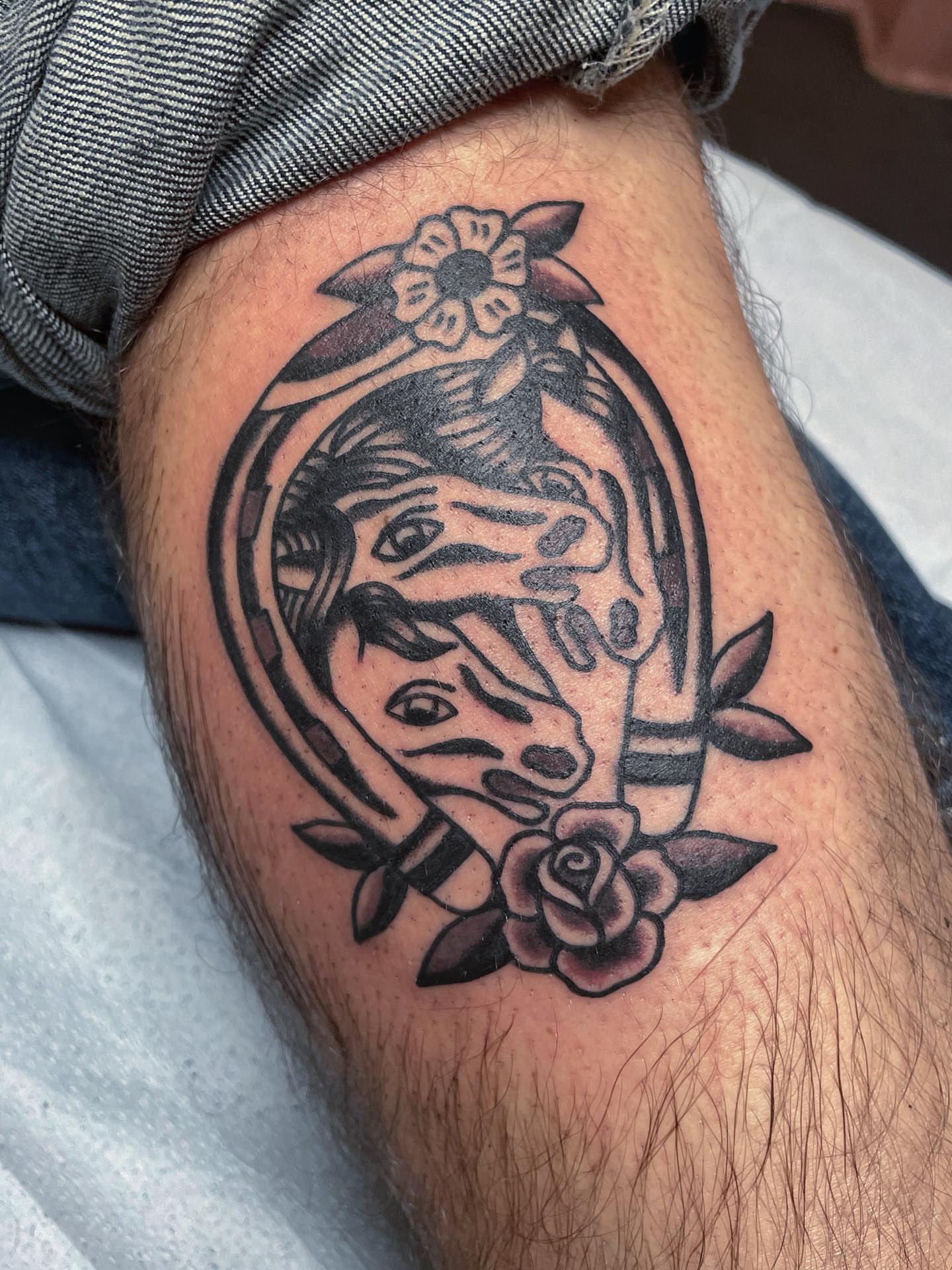 Skull and flowers American traditional tattoo on the thigh by nancy❣️