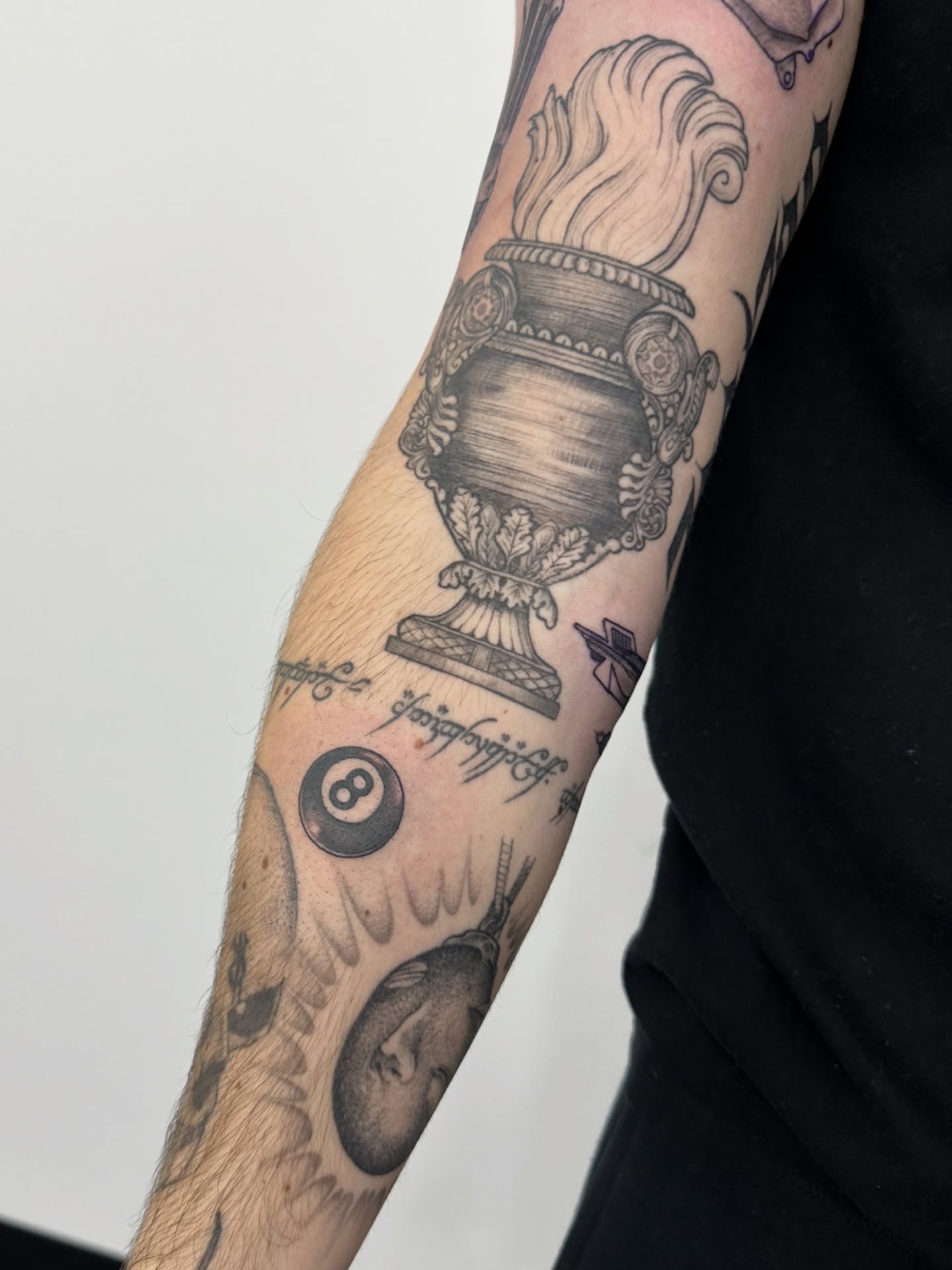 Urn with flame black and grey tattoo on the forearm by ๐ฌ๐๐๐ฏ๐ ๐ฆ ๐๐ฉ๐ฆ๐ท๐๐๐ข๐ฑ๐ฅ ๐ซง๐ผ, Joplin, Missouri
