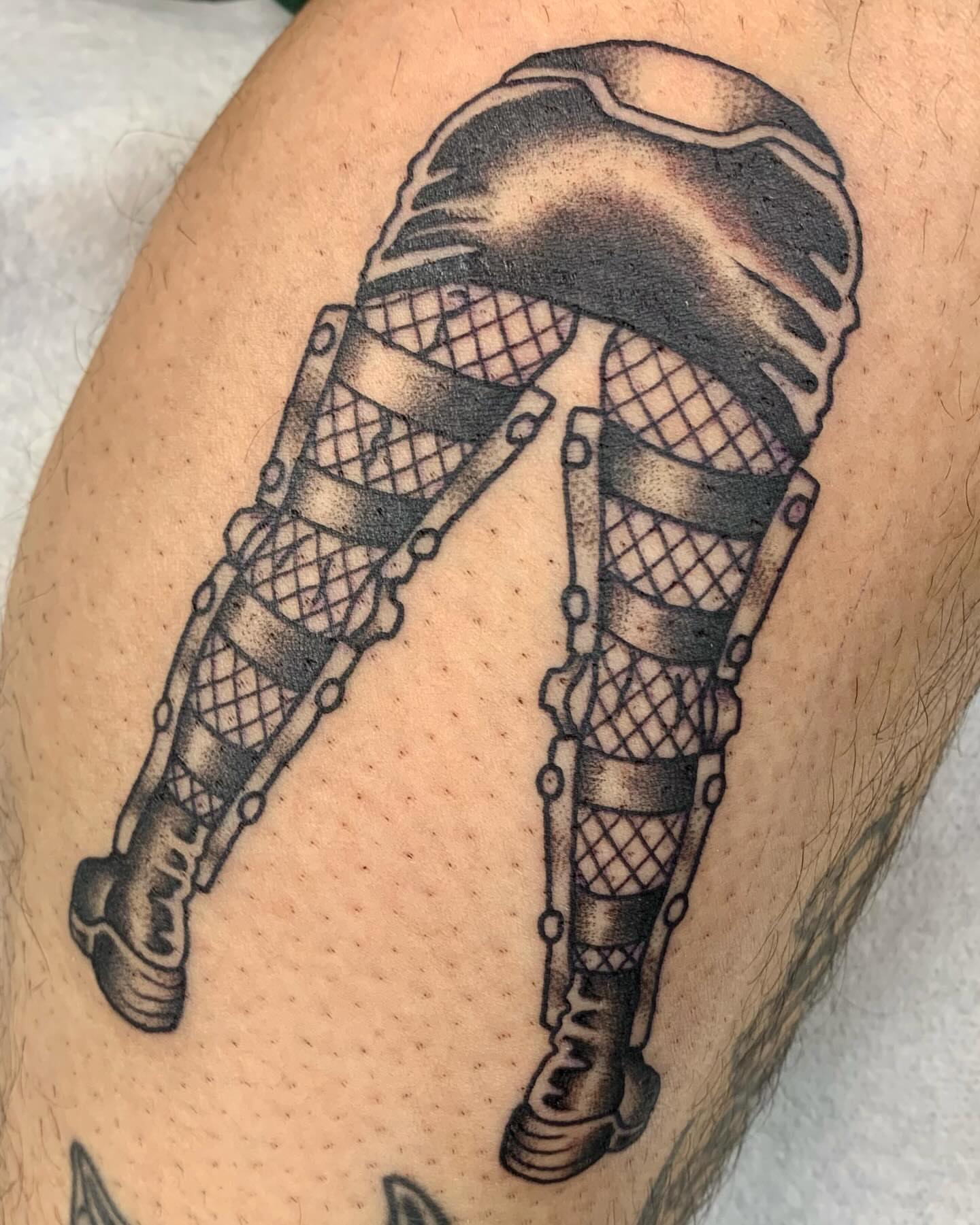 Robotic leg black and grey tattoo on the thigh by jay