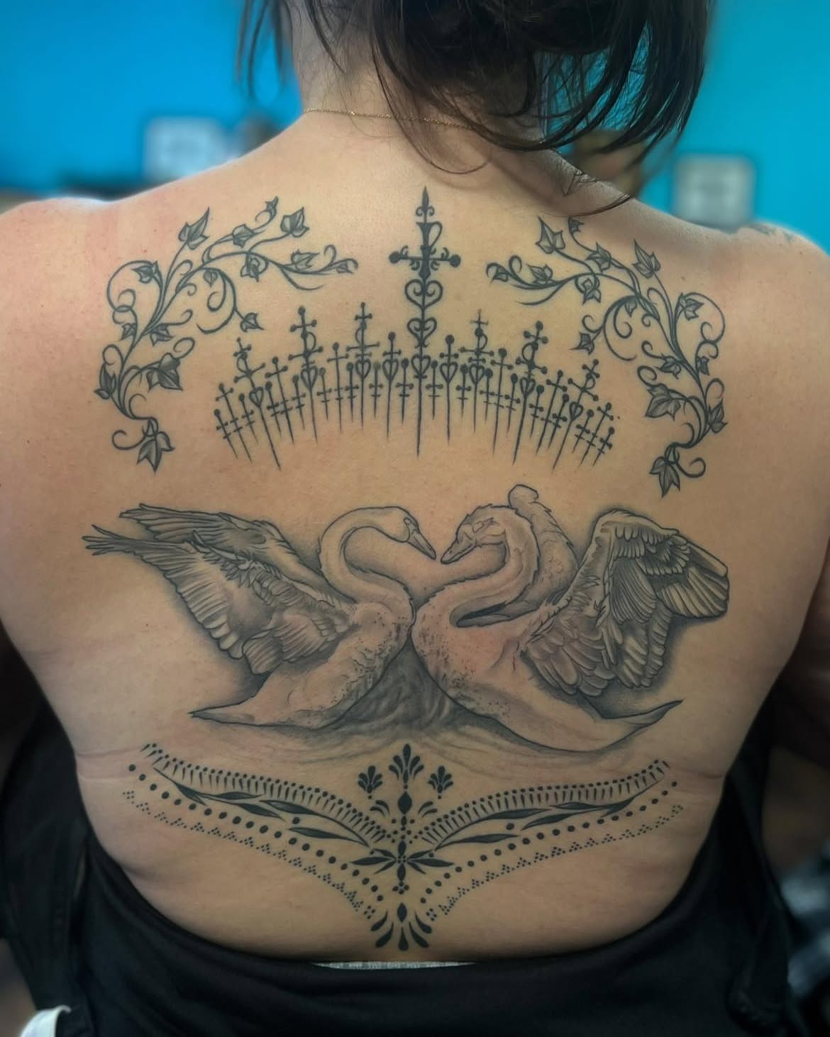 Swans realism tattoo on the back by Chelsea Nichole