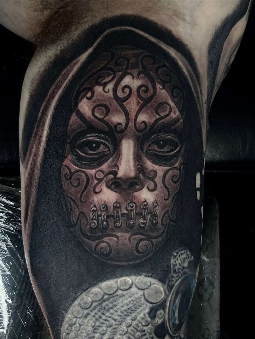 Skull mask face with ornate patterns realism tattoo on the forearm by Jayden A
