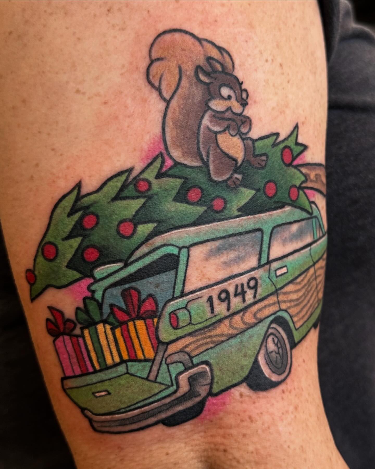 Christmas tree and van American traditional tattoo on the thigh by Katie Beth