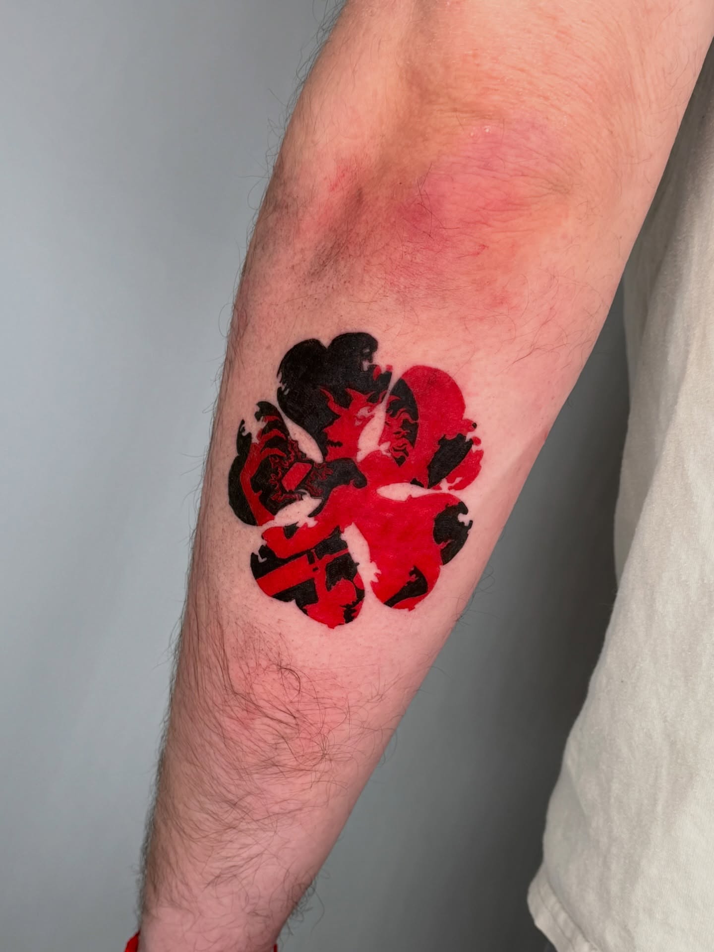 Flower dotwork tattoo on the forearm by Jerm Lewis