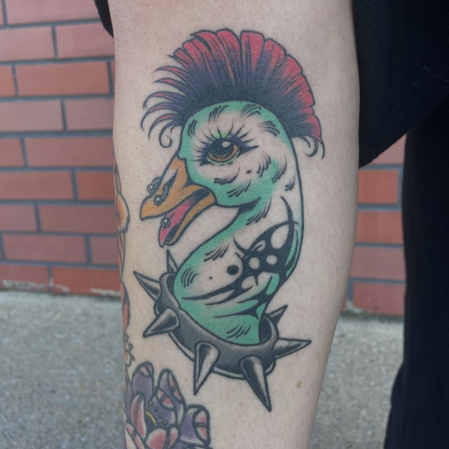 Punk duck new school tattoo on the forearm by Fionna Fanning