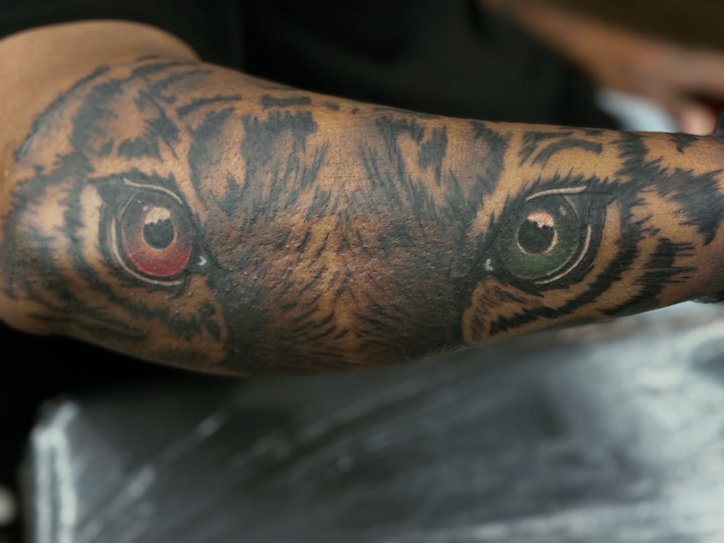 Eyes realism tattoo on the forearm by Sk Pierce