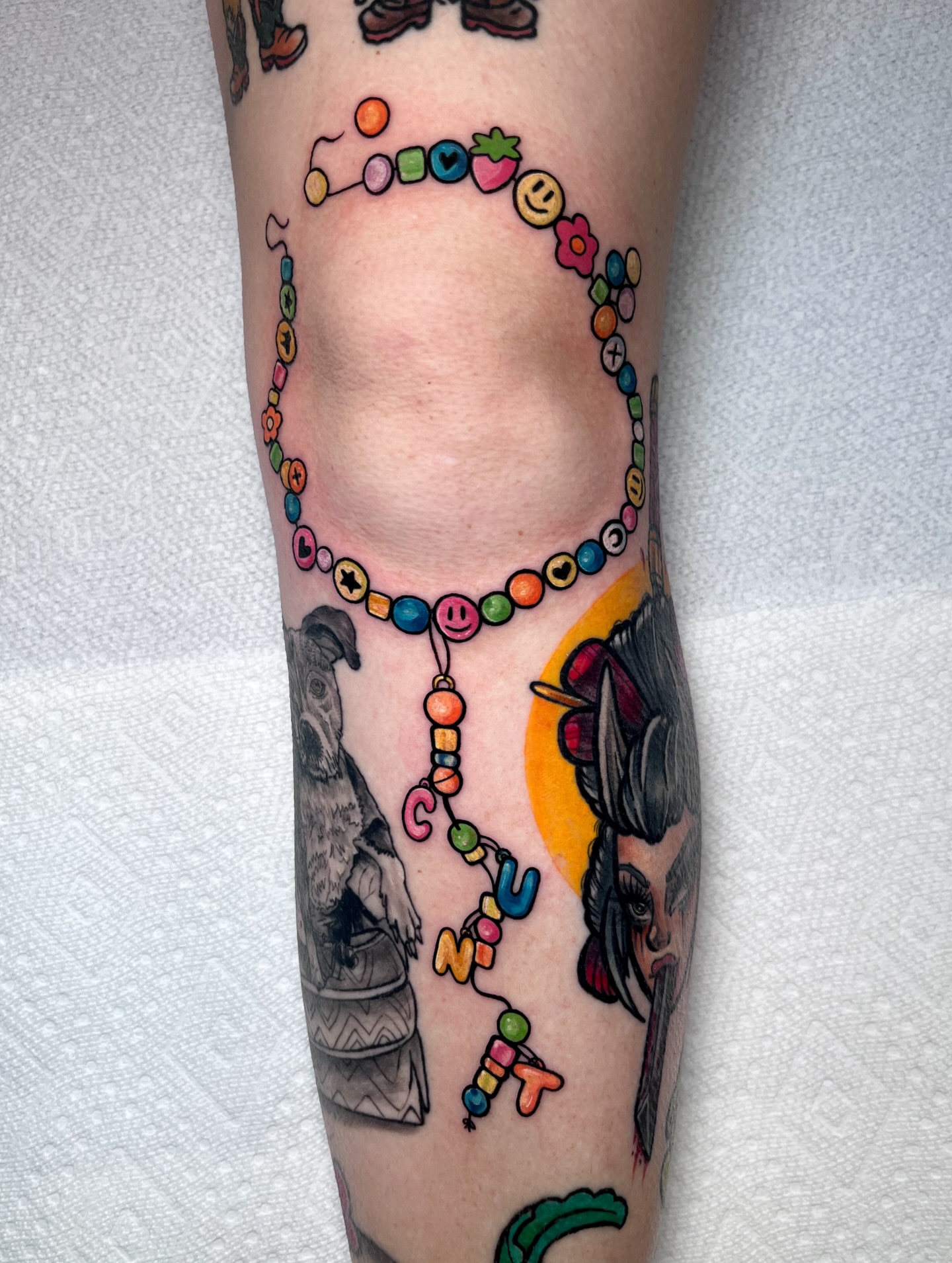 Beaded necklace new school tattoo on the forearm by ʙᴇᴄᴄᴀ ʟʏɴɴ