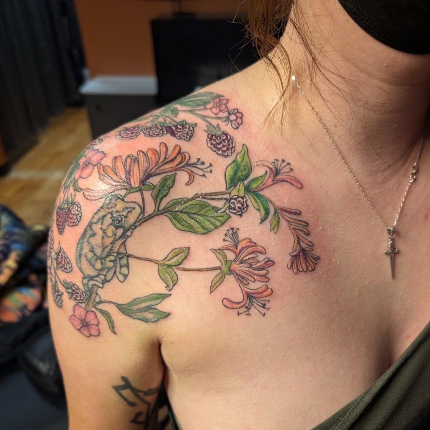 Chameleon and floral realism tattoo on the shoulder by Kelly Von Tattoos, Saxapahaw, North Carolina
