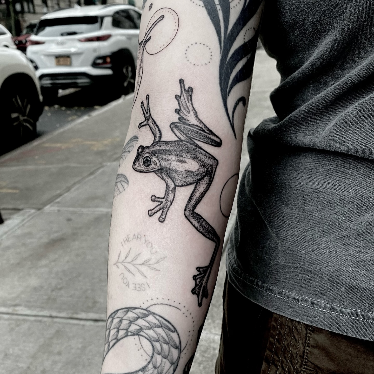 Frog dotwork tattoo on the forearm by Rowan Starr