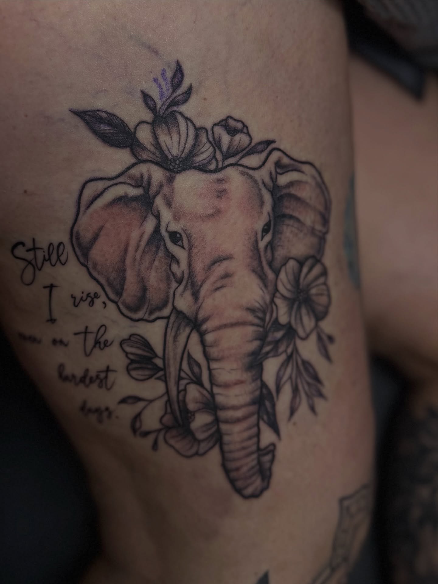 Elephant with flowers black and grey tattoo on the thigh by Charlotte Nc📍tattoo Artist