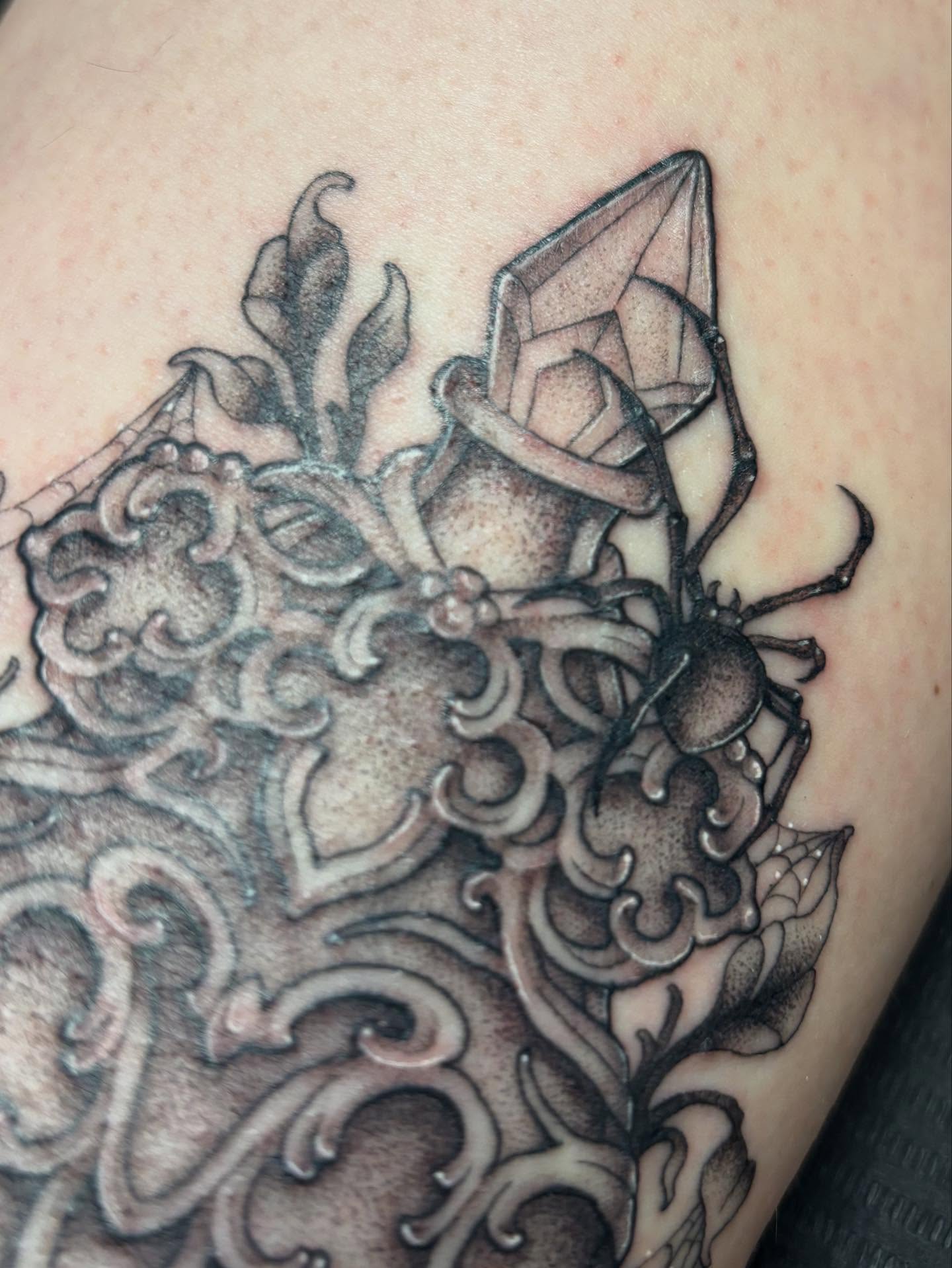 Beetle and crystal geometric tattoo on the shoulder by Rachel Foster