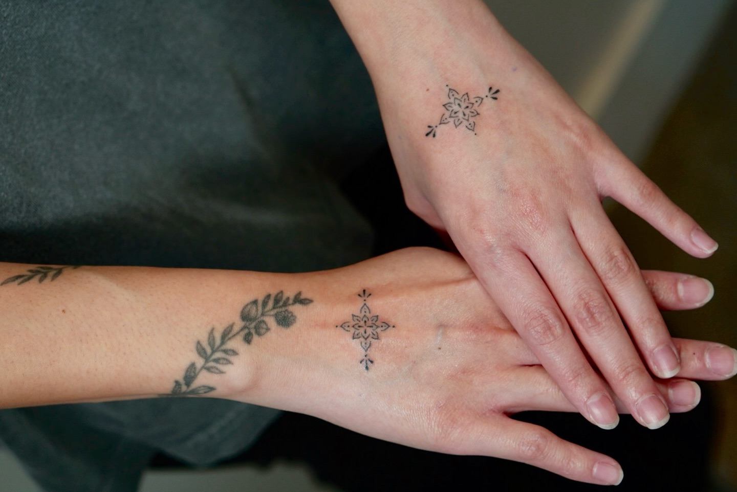 Cross and floral geometric tattoo on the forearm by IVY K ༄ ATX Handpoke Artist