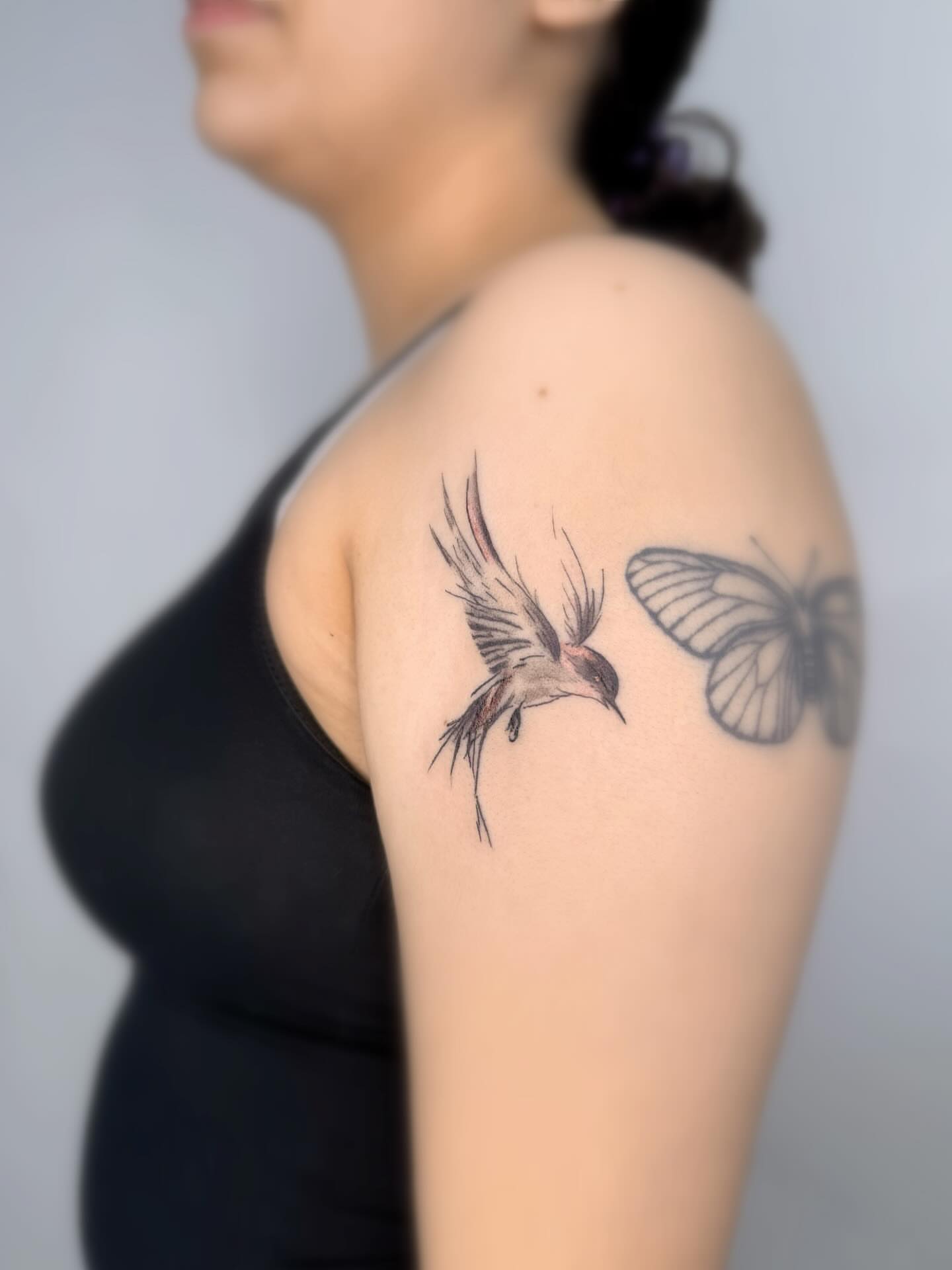 Bird and butterfly realism tattoo on the shoulder by Joey tattoo