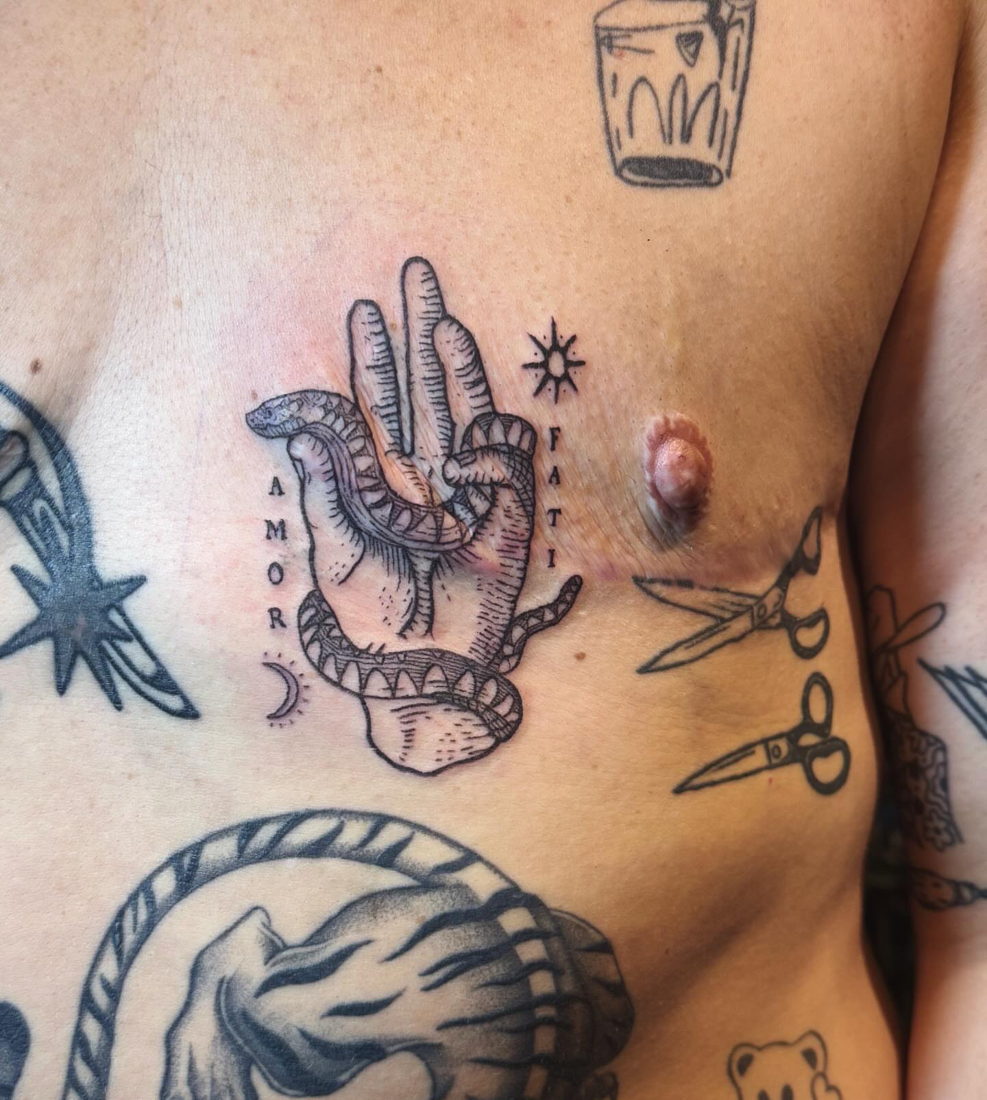 Hand with snake American traditional tattoo on the chest by Luna Enriquez⚡️, Portland, Oregon