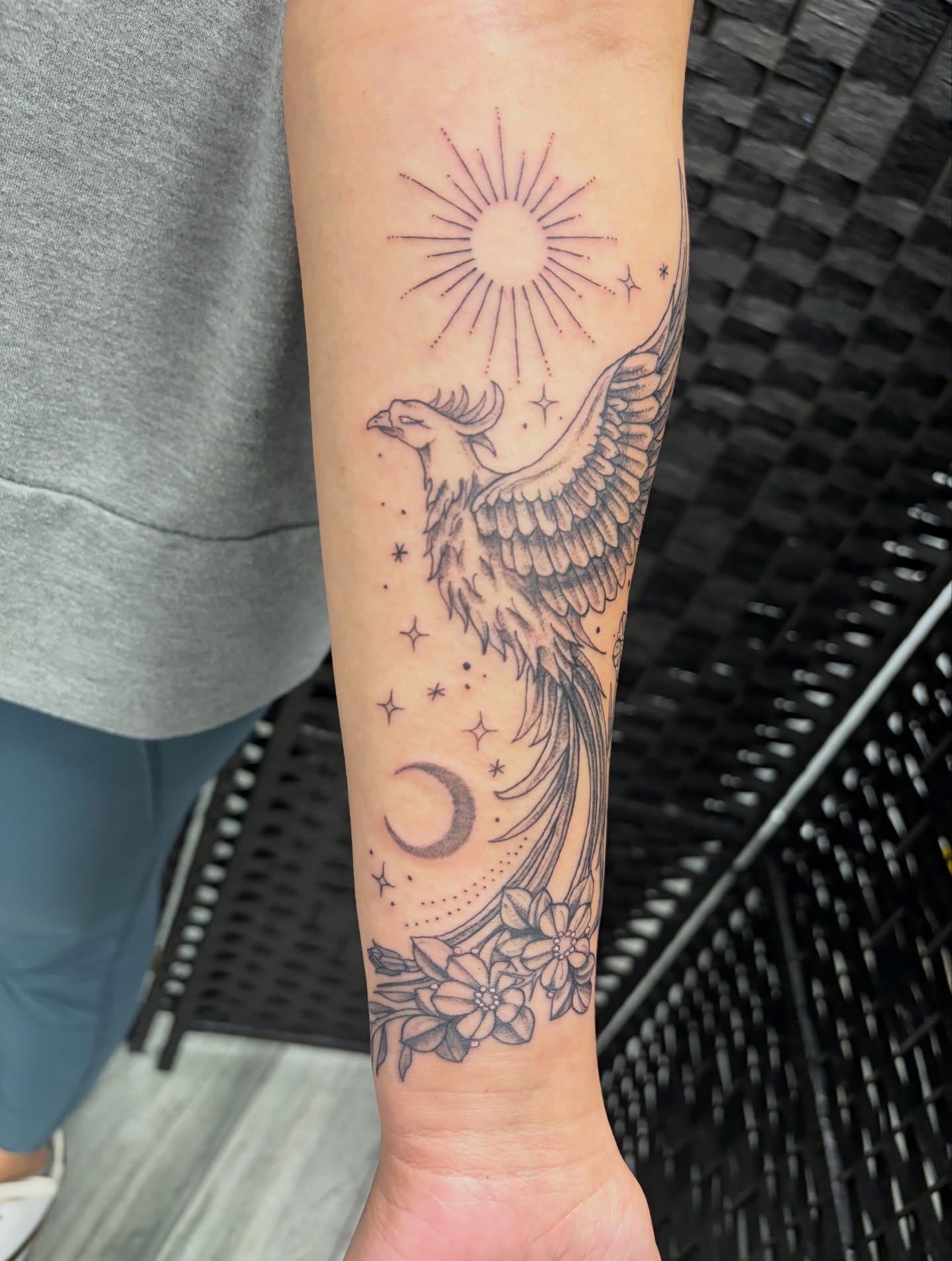 Phoenix black and grey tattoo on the forearm by Brittany Brutal