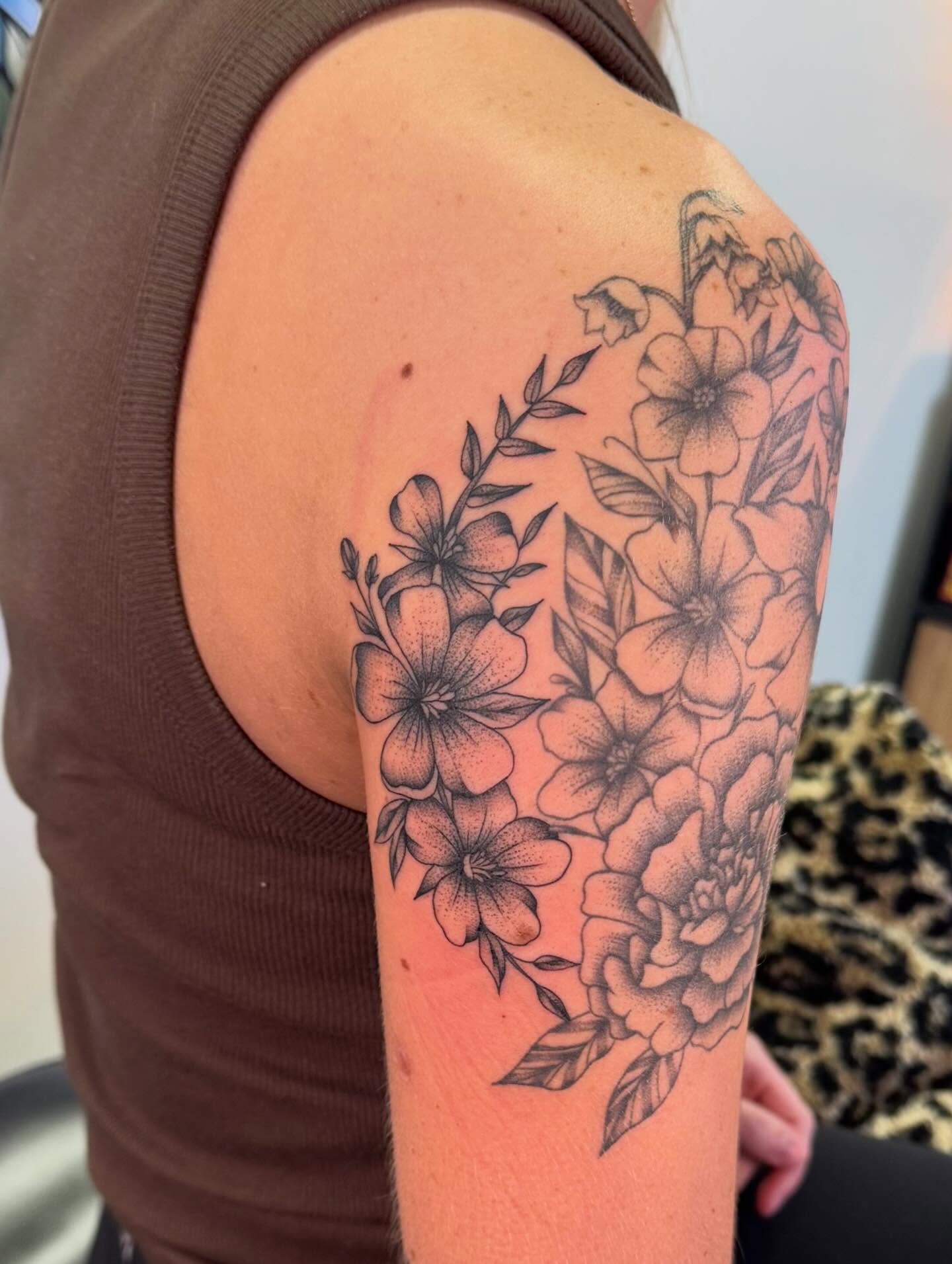 Floral bouquet dotwork tattoo on the shoulder by haylie