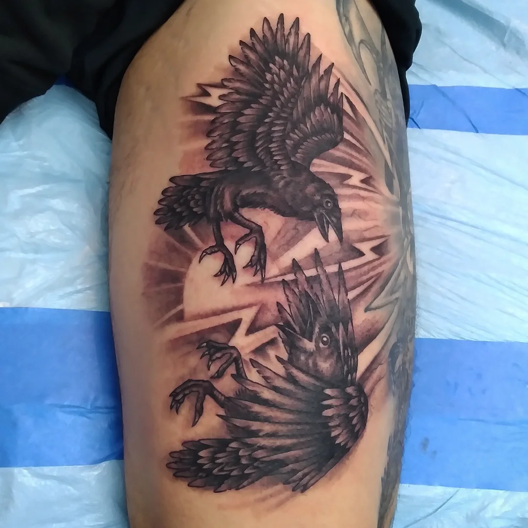 Ravens realism tattoo on the thigh by Josh Sroga
