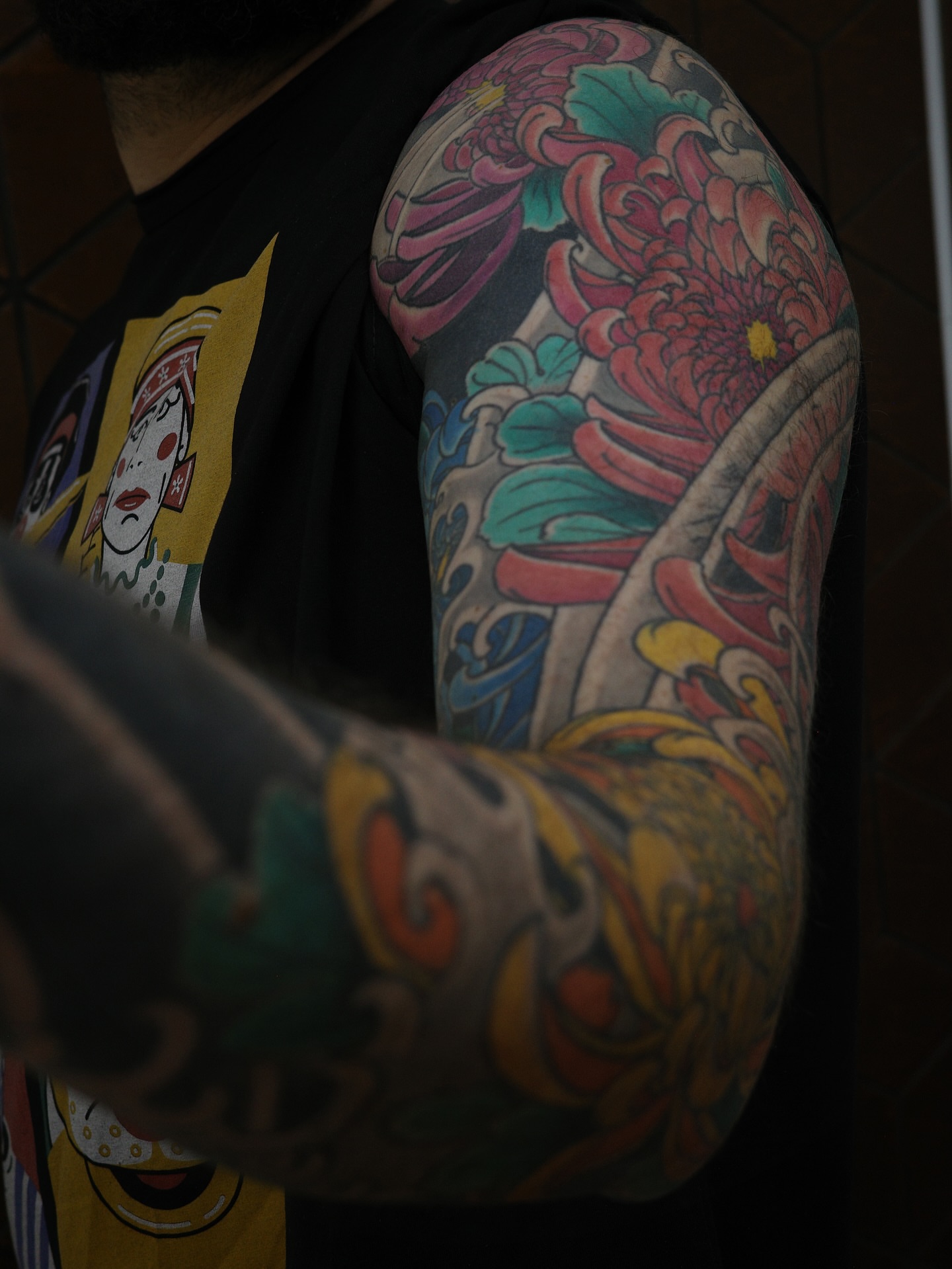 Floral bouquet japanese irezumi tattoo on the upper arm by Innokenty Meshchakov, Portland, Oregon